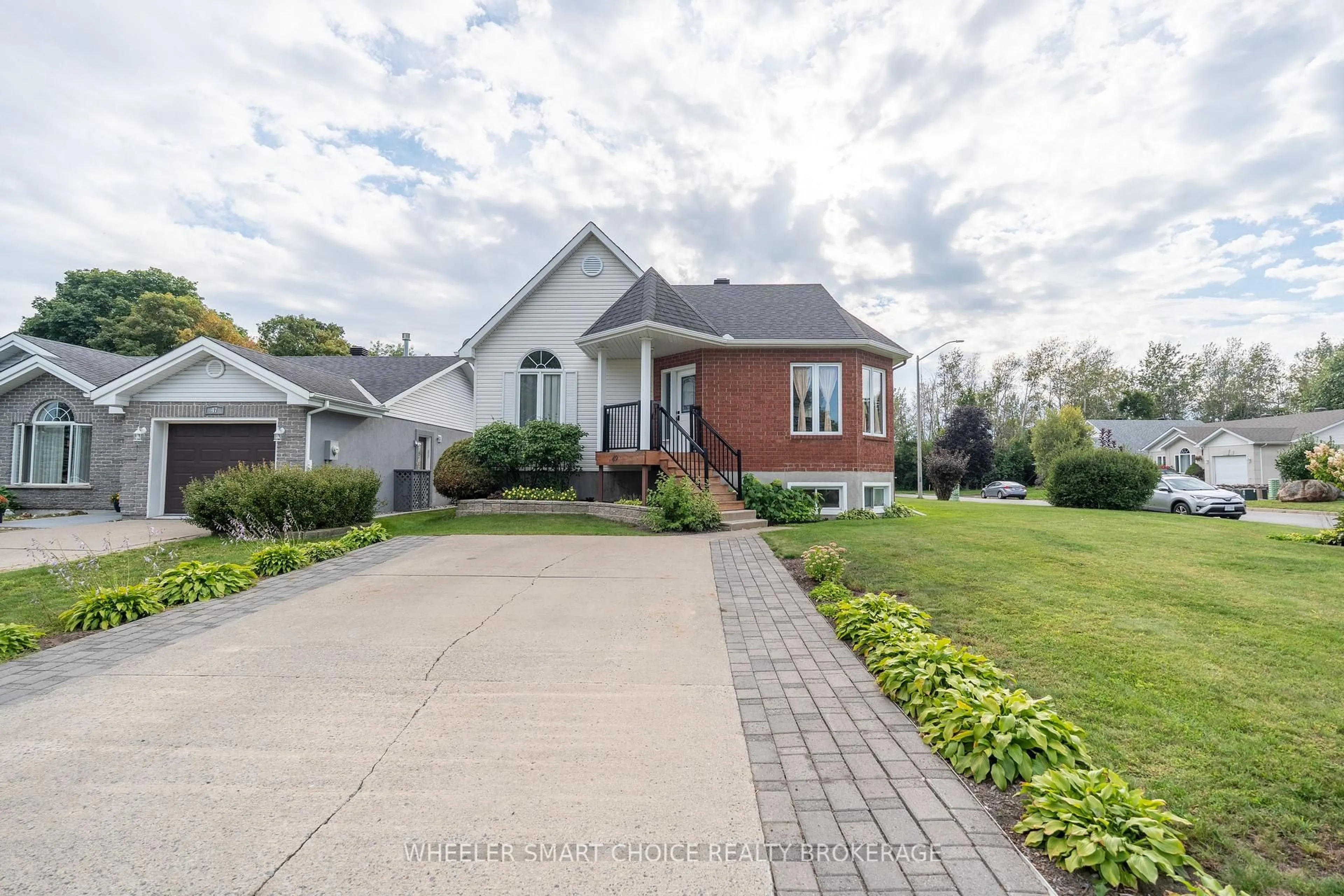 Home with brick exterior material, street for 49 Barnhart Dr, South Stormont Ontario K0C 1P0
