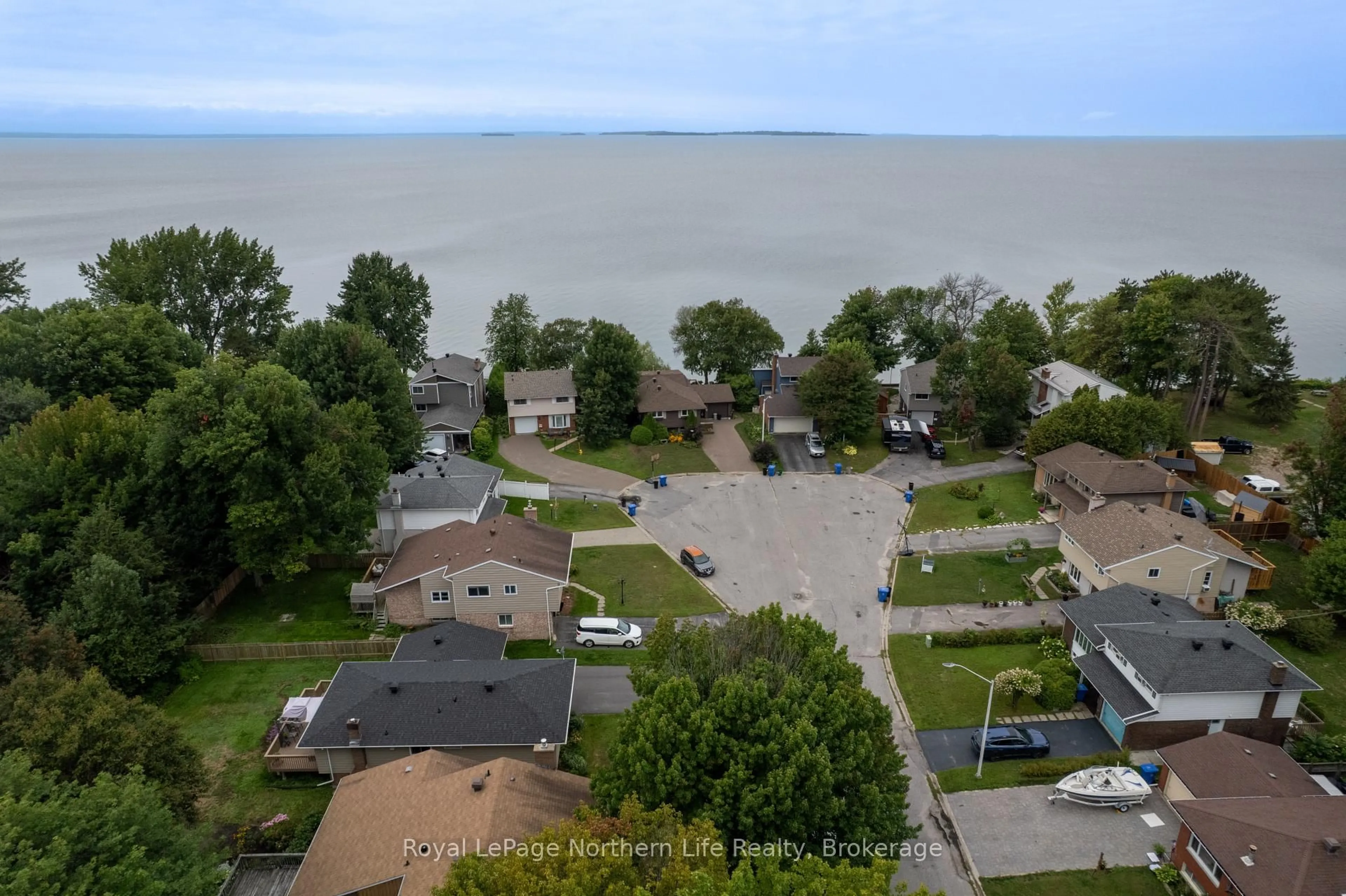 A pic from outside/outdoor area/front of a property/back of a property/a pic from drone, water/lake/river/ocean view for 29 Shore Acres Blvd, North Bay Ontario P1A 1B7