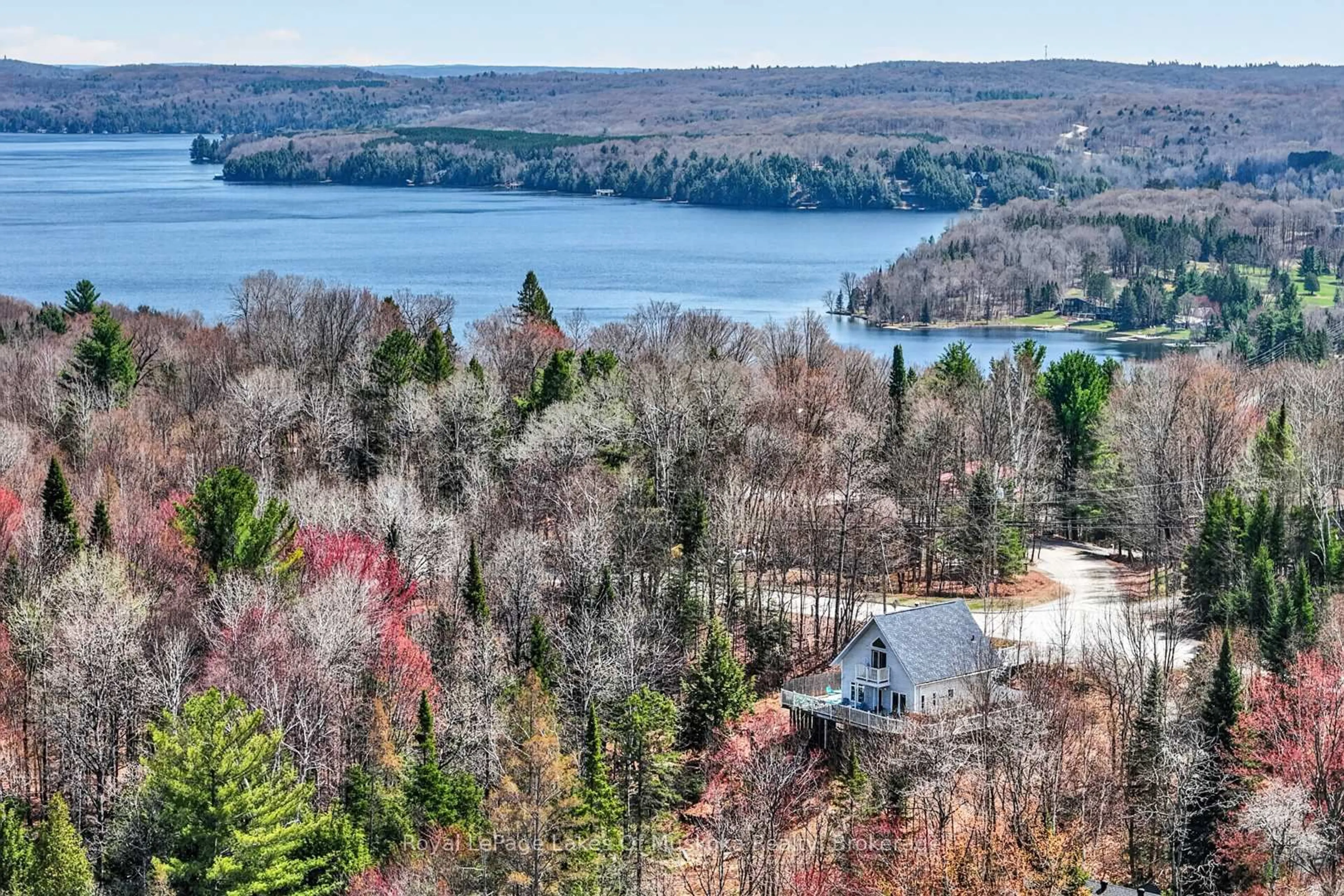 A pic from outside/outdoor area/front of a property/back of a property/a pic from drone, water/lake/river/ocean view for 1616 Skyline Dr, Huntsville Ontario P1H 1A5