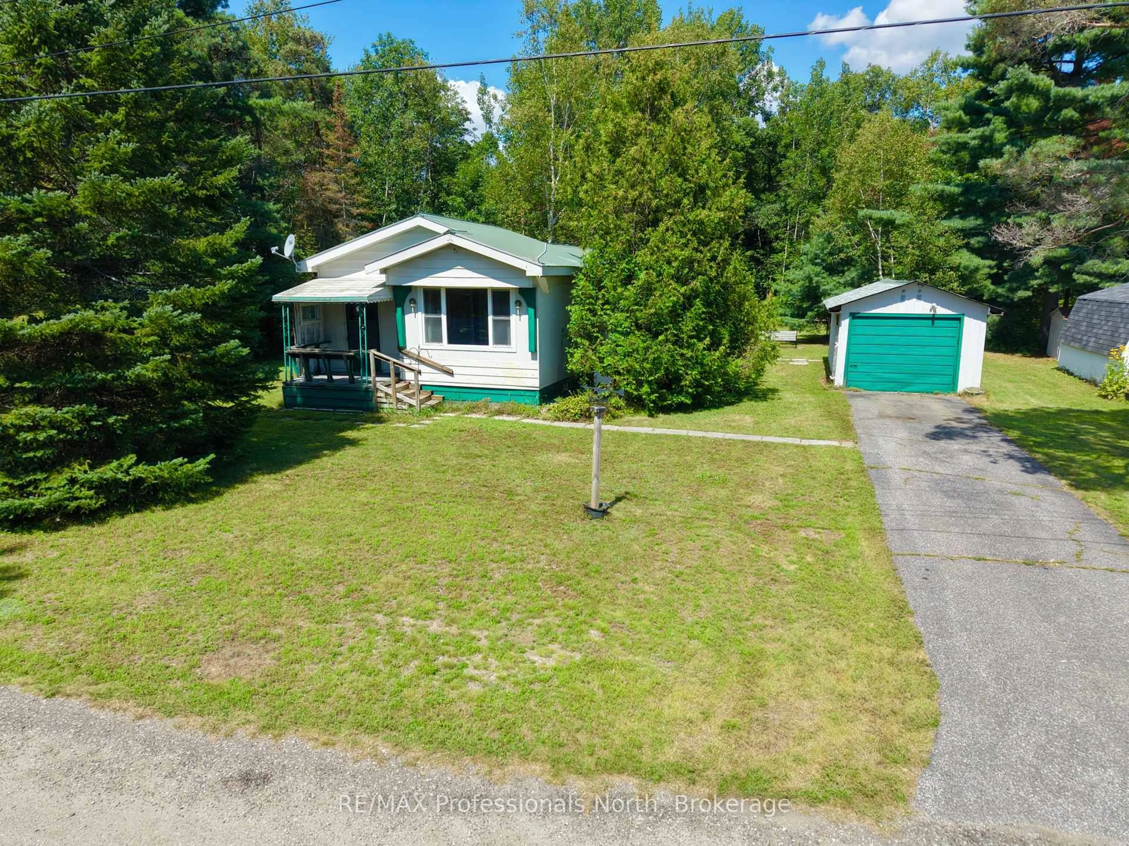 A pic from outside/outdoor area/front of a property/back of a property/a pic from drone, street for 1053 Seventh Lane, Minden Hills Ontario K0M 2K0
