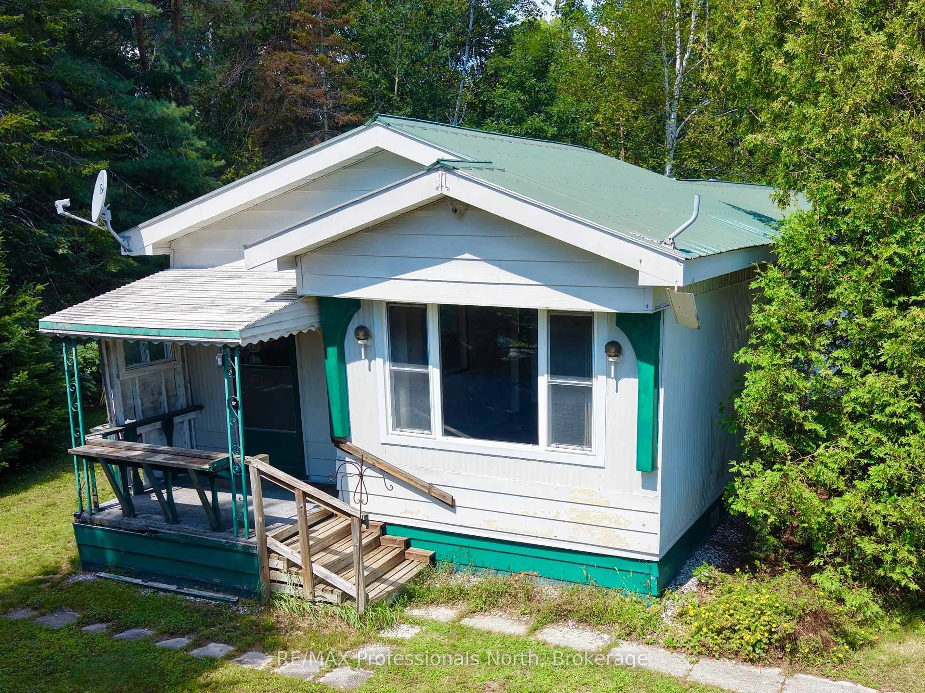 A pic from outside/outdoor area/front of a property/back of a property/a pic from drone, street for 1053 Seventh Lane, Minden Hills Ontario K0M 2K0