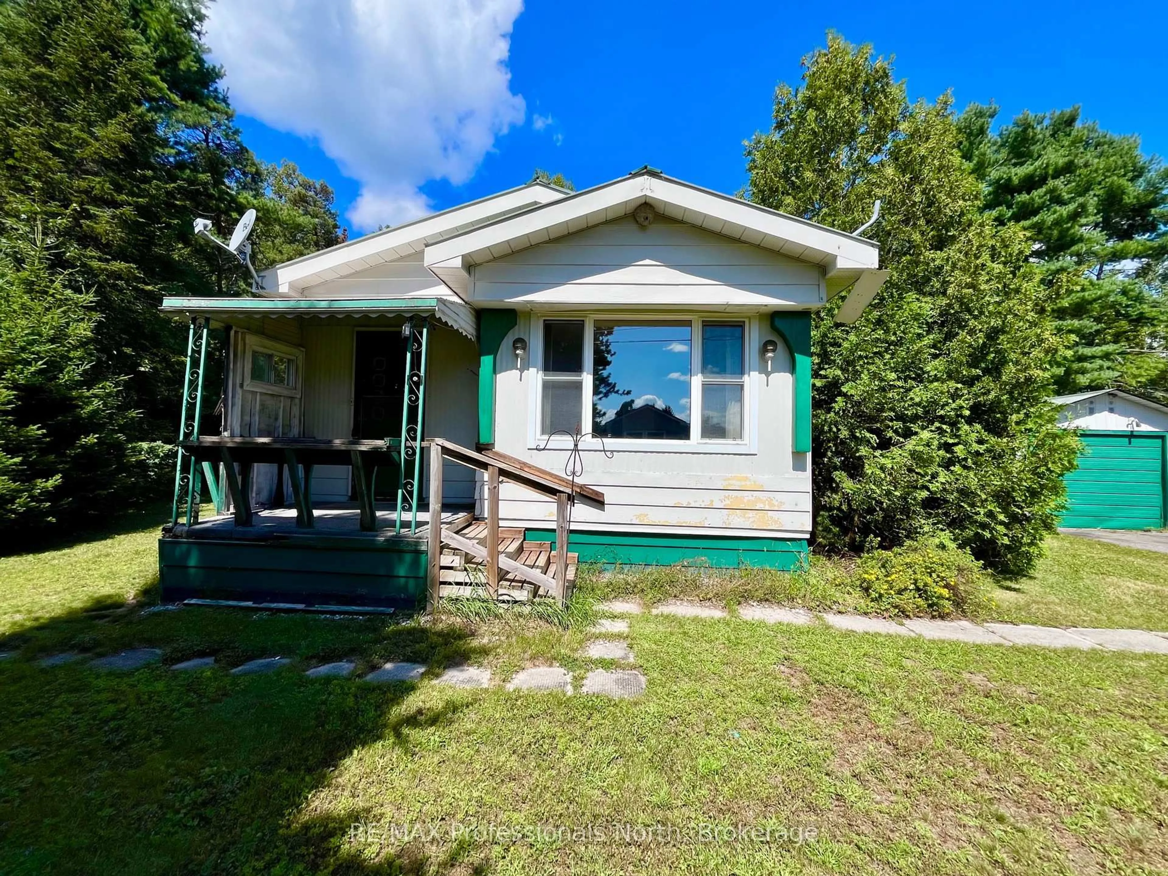 Home with vinyl exterior material, street for 1053 Seventh Lane, Minden Hills Ontario K0M 2K0