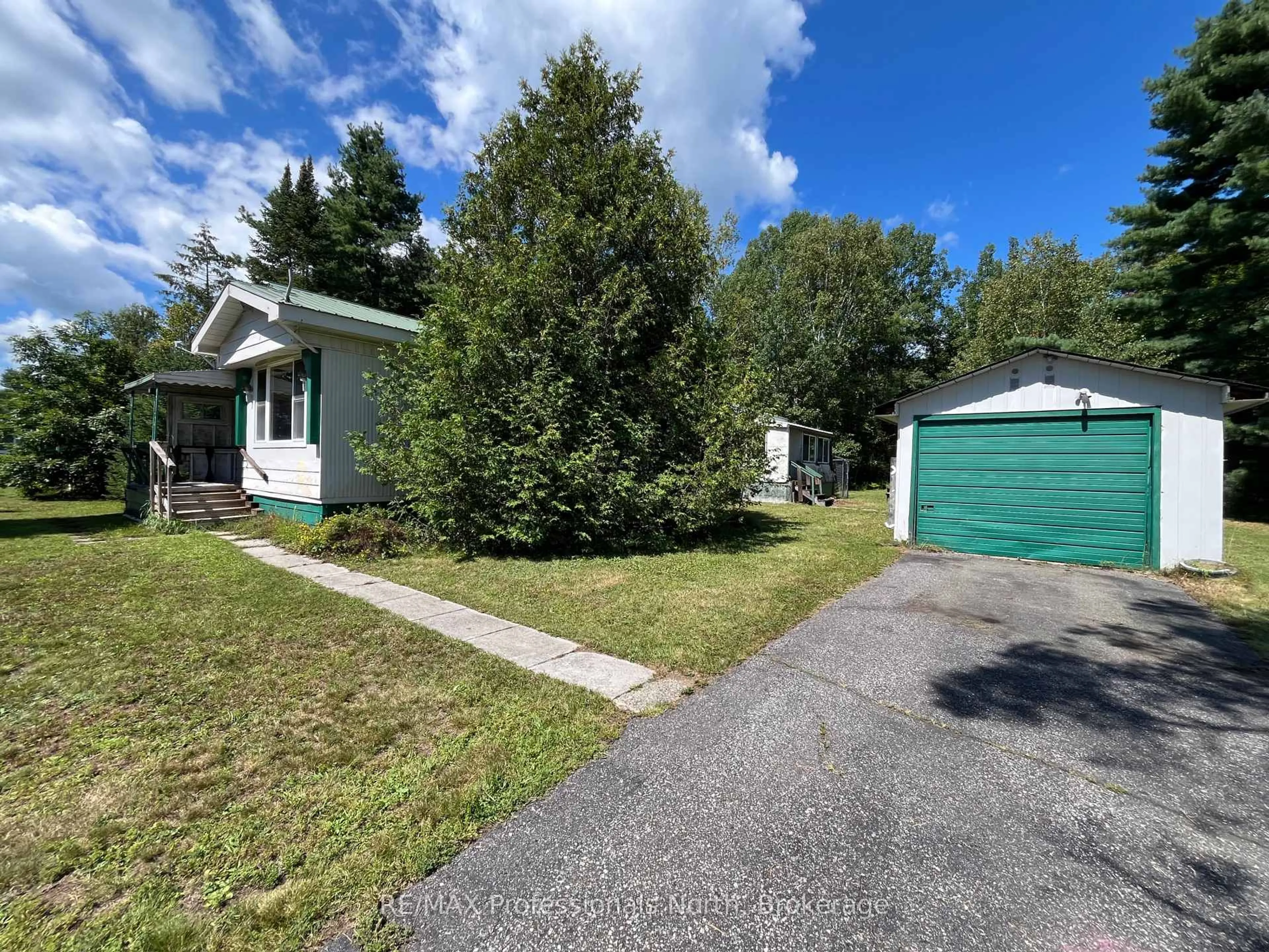 A pic from outside/outdoor area/front of a property/back of a property/a pic from drone, street for 1053 Seventh Lane, Minden Hills Ontario K0M 2K0