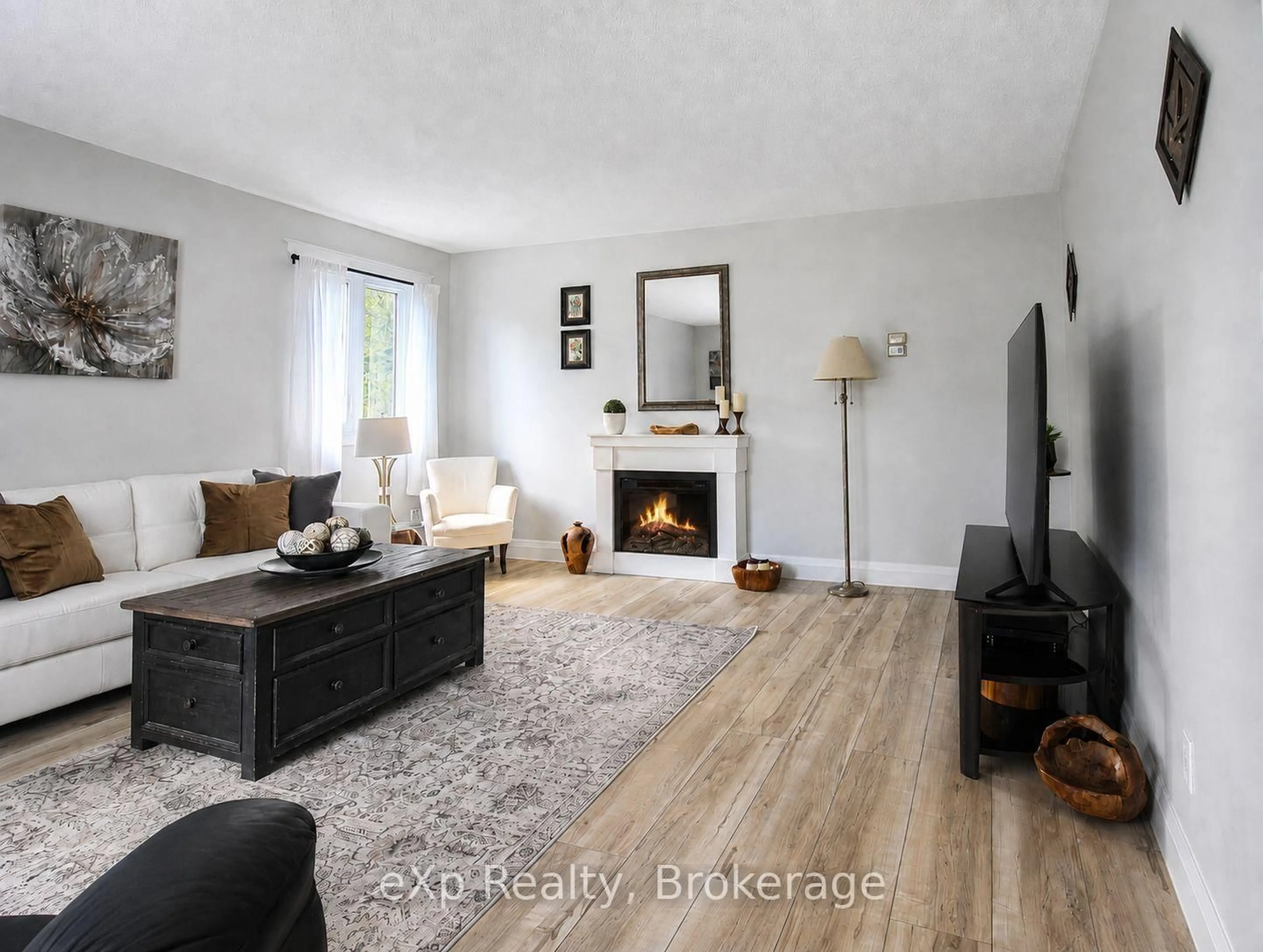Living room with furniture, wood/laminate floor for 271 River Rd, Grey Highlands Ontario N0C 1C0