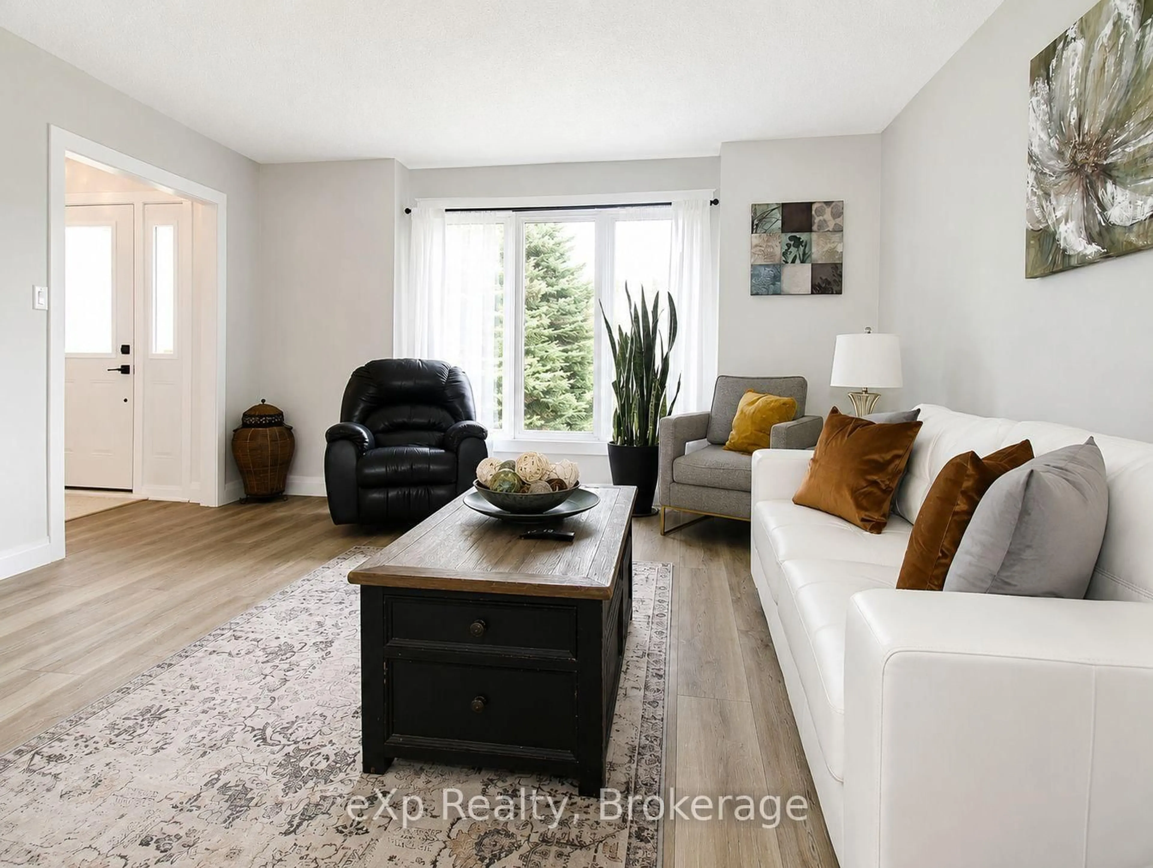 Living room with furniture, wood/laminate floor for 271 River Rd, Grey Highlands Ontario N0C 1C0