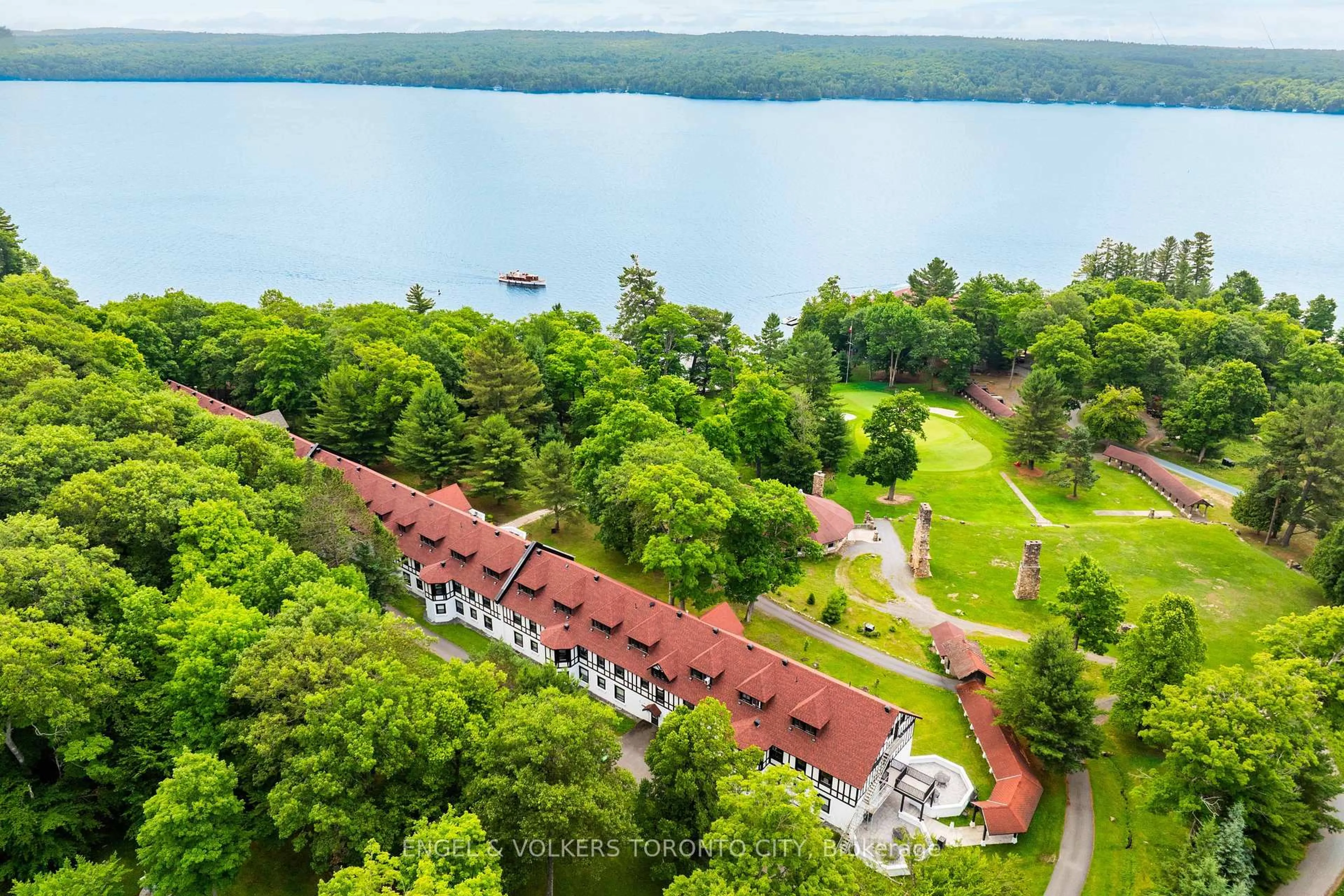 A pic from outside/outdoor area/front of a property/back of a property/a pic from drone, water/lake/river/ocean view for 12 Bigwin Island #221, Lake of Bays Ontario P0B 1A0