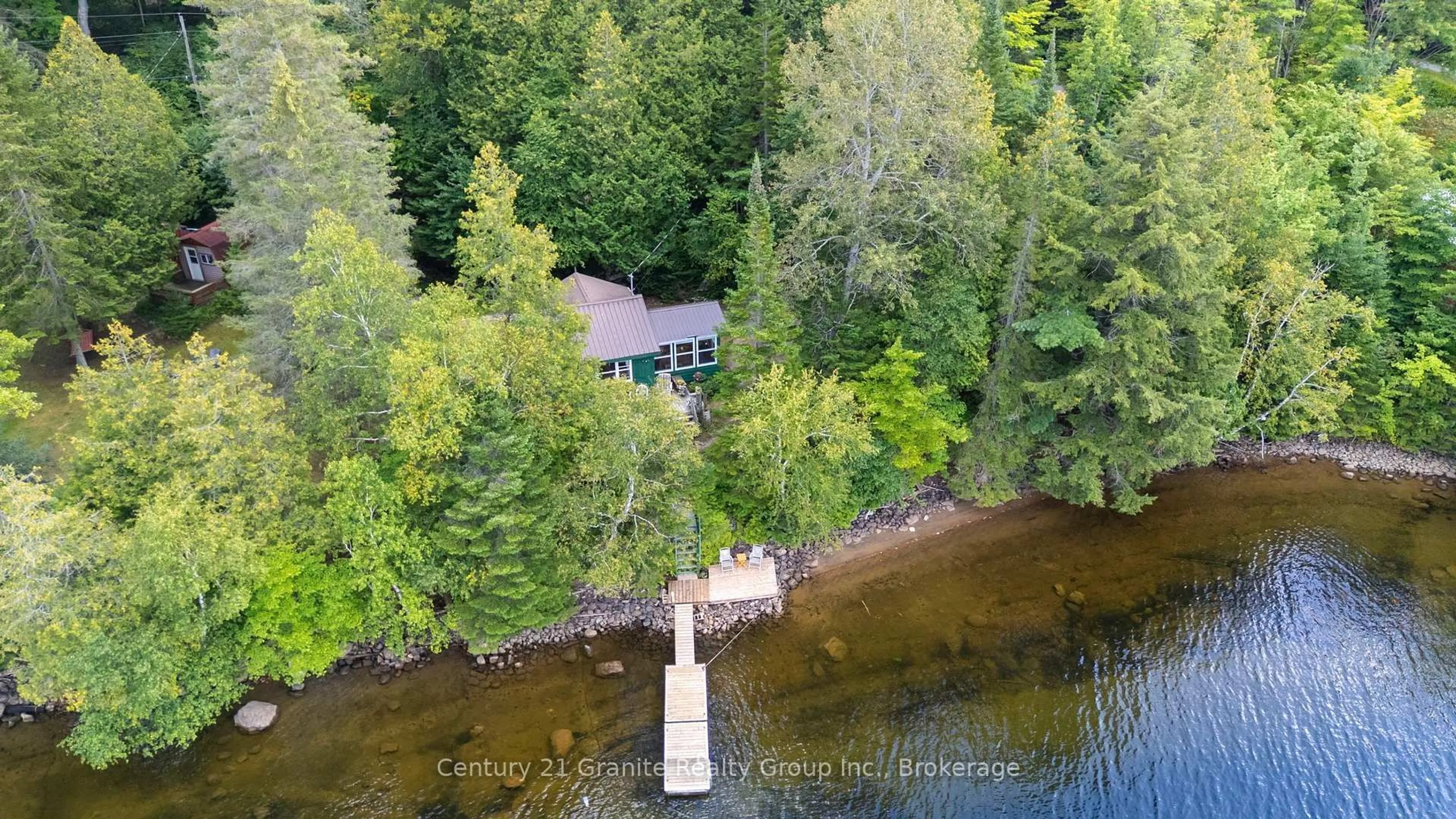 A pic from outside/outdoor area/front of a property/back of a property/a pic from drone, water/lake/river/ocean view for 1010 Badger Lane, Dysart et al Ontario K0M 1S0