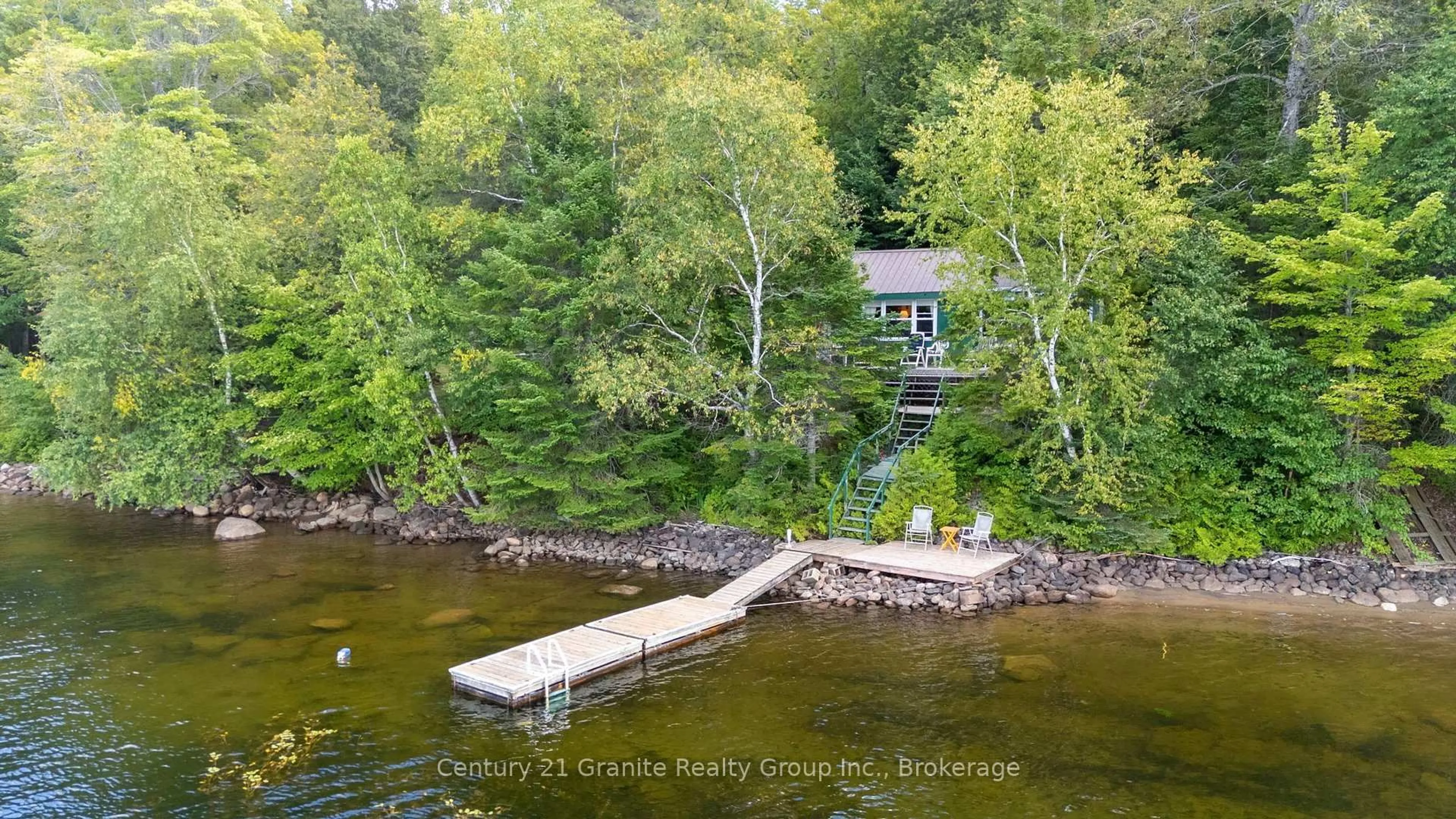 A pic from outside/outdoor area/front of a property/back of a property/a pic from drone, water/lake/river/ocean view for 1010 Badger Lane, Dysart et al Ontario K0M 1S0