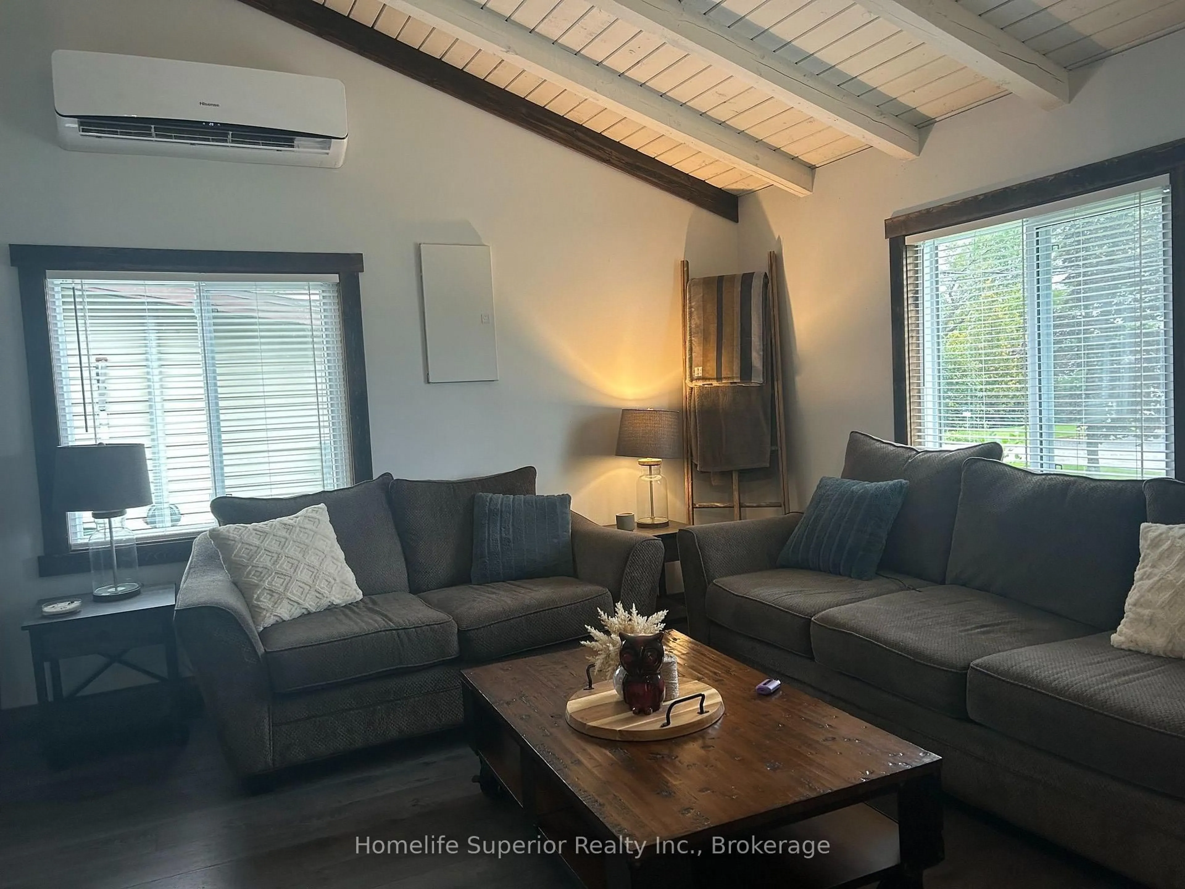 Living room with furniture, wood/laminate floor for 132 Peepyhorn Rd, Limoges Ontario K0K 2M0