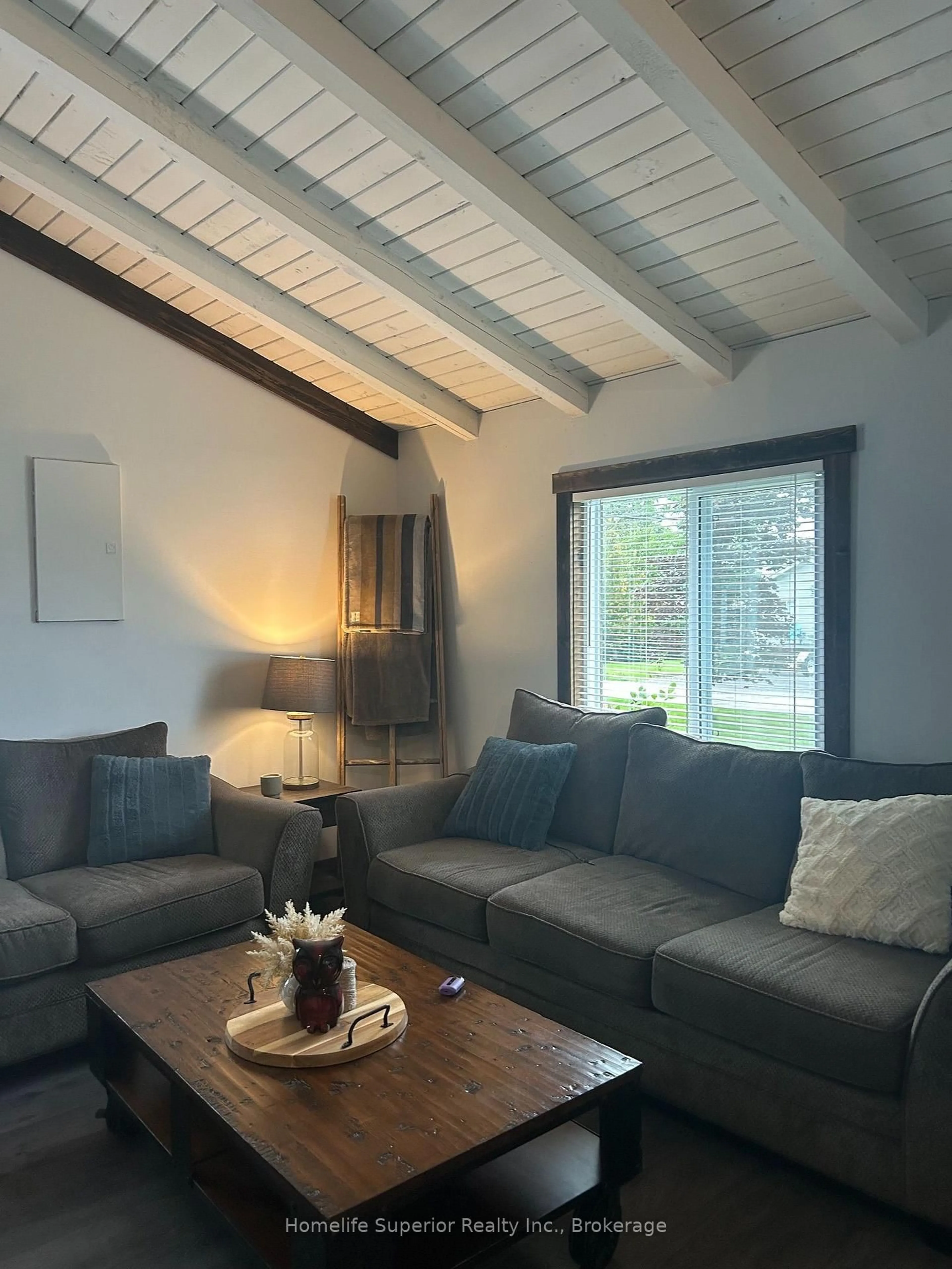 Living room with furniture, wood/laminate floor for 132 Peepyhorn Rd, Limoges Ontario K0K 2M0