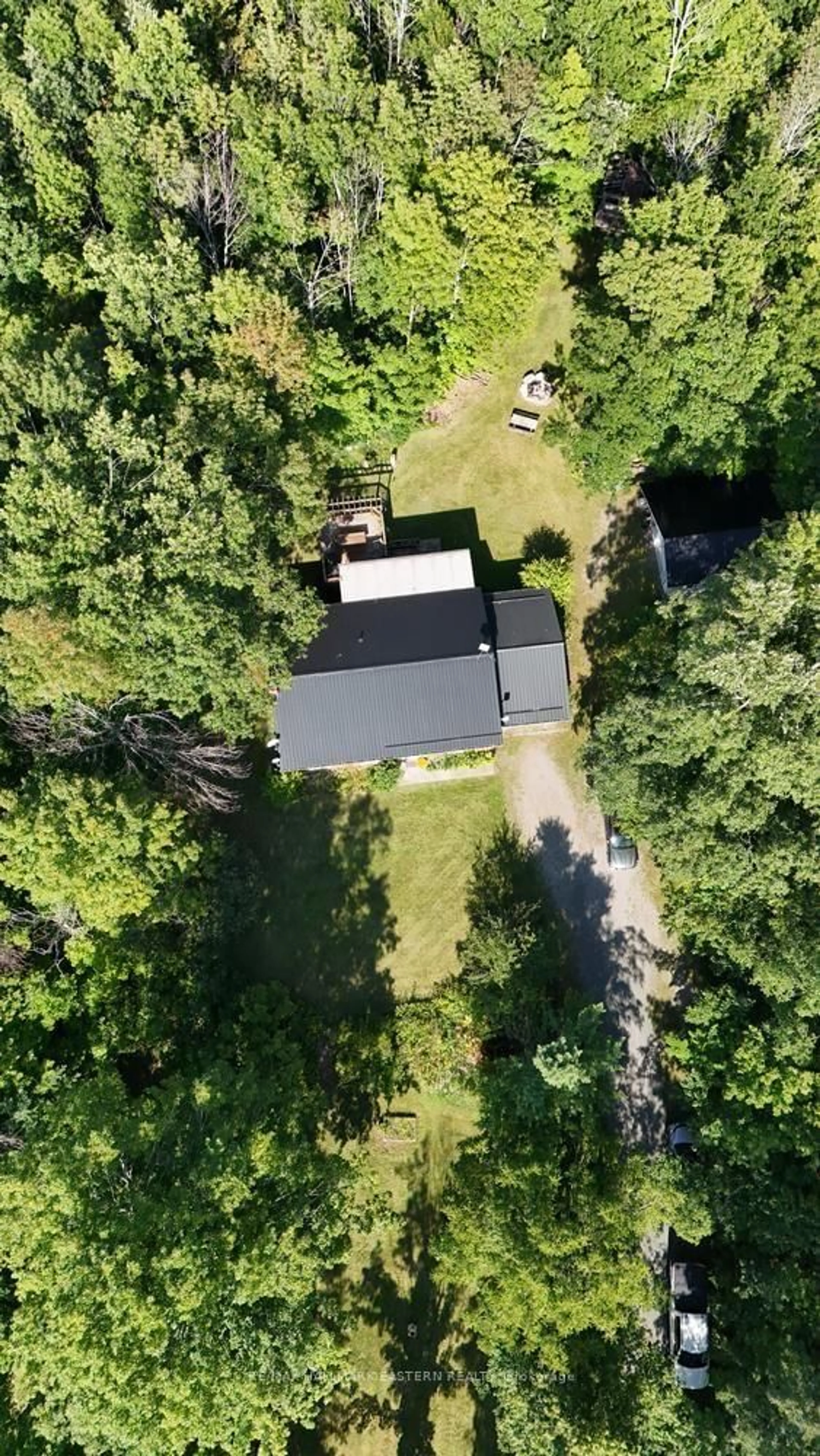 A pic from outside/outdoor area/front of a property/back of a property/a pic from drone, forest/trees view for 965 Crowe River Rd, Trent Hills Ontario K0K 2M0