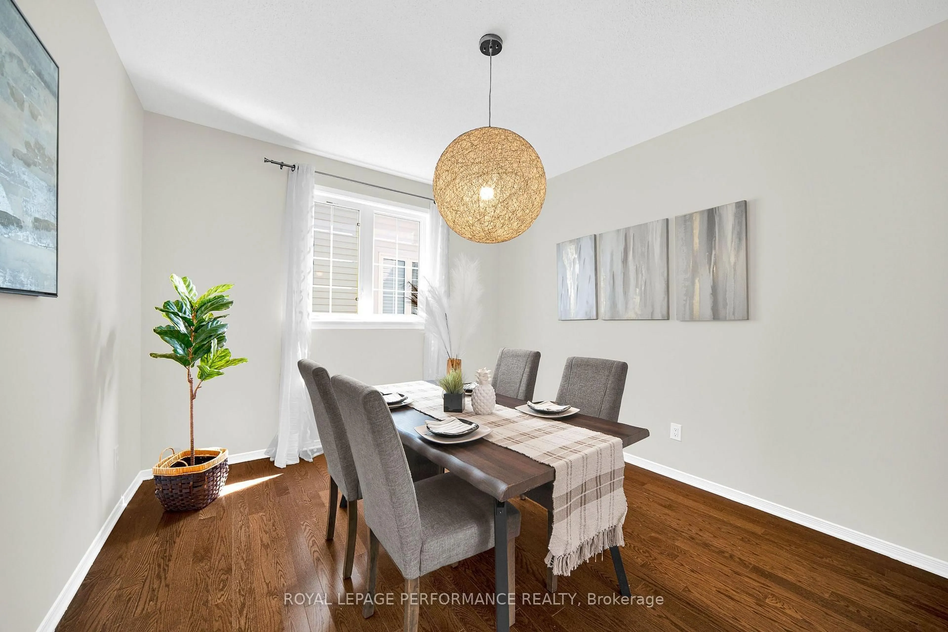 Dining room, wood/laminate floor for 593 PINAWA Circ, Ottawa Ontario K2J 5Y2