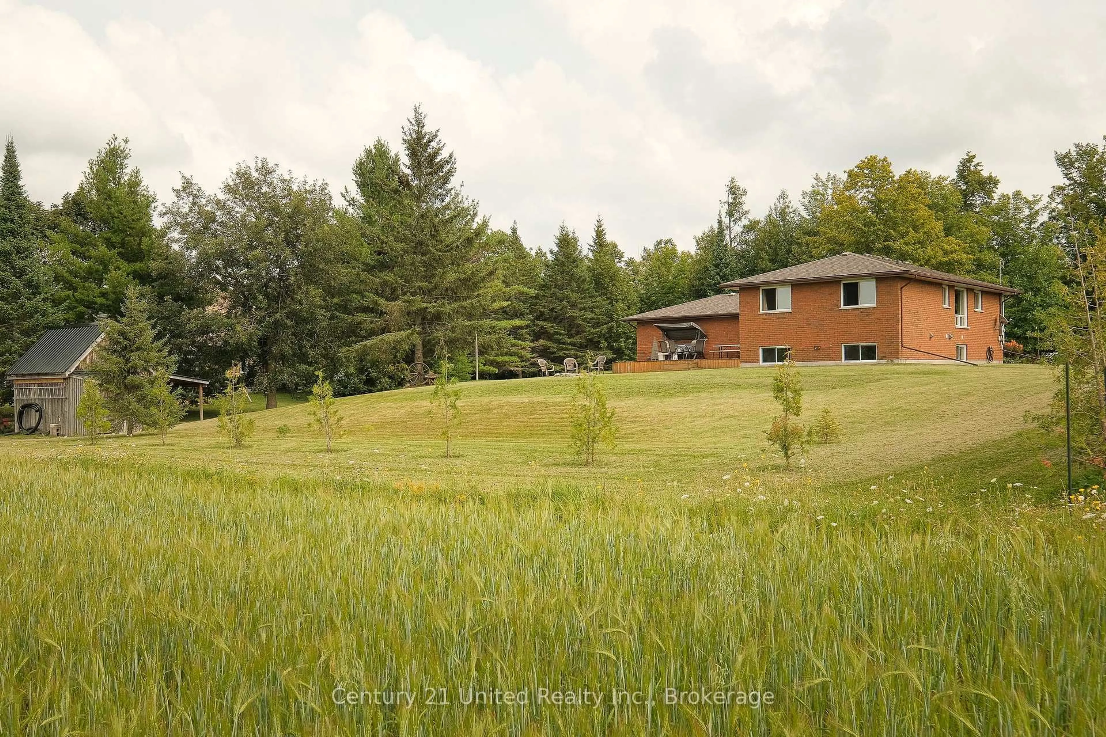 A pic from outside/outdoor area/front of a property/back of a property/a pic from drone, forest/trees view for 1118 5th Line, Selwyn Ontario K9J 6X5