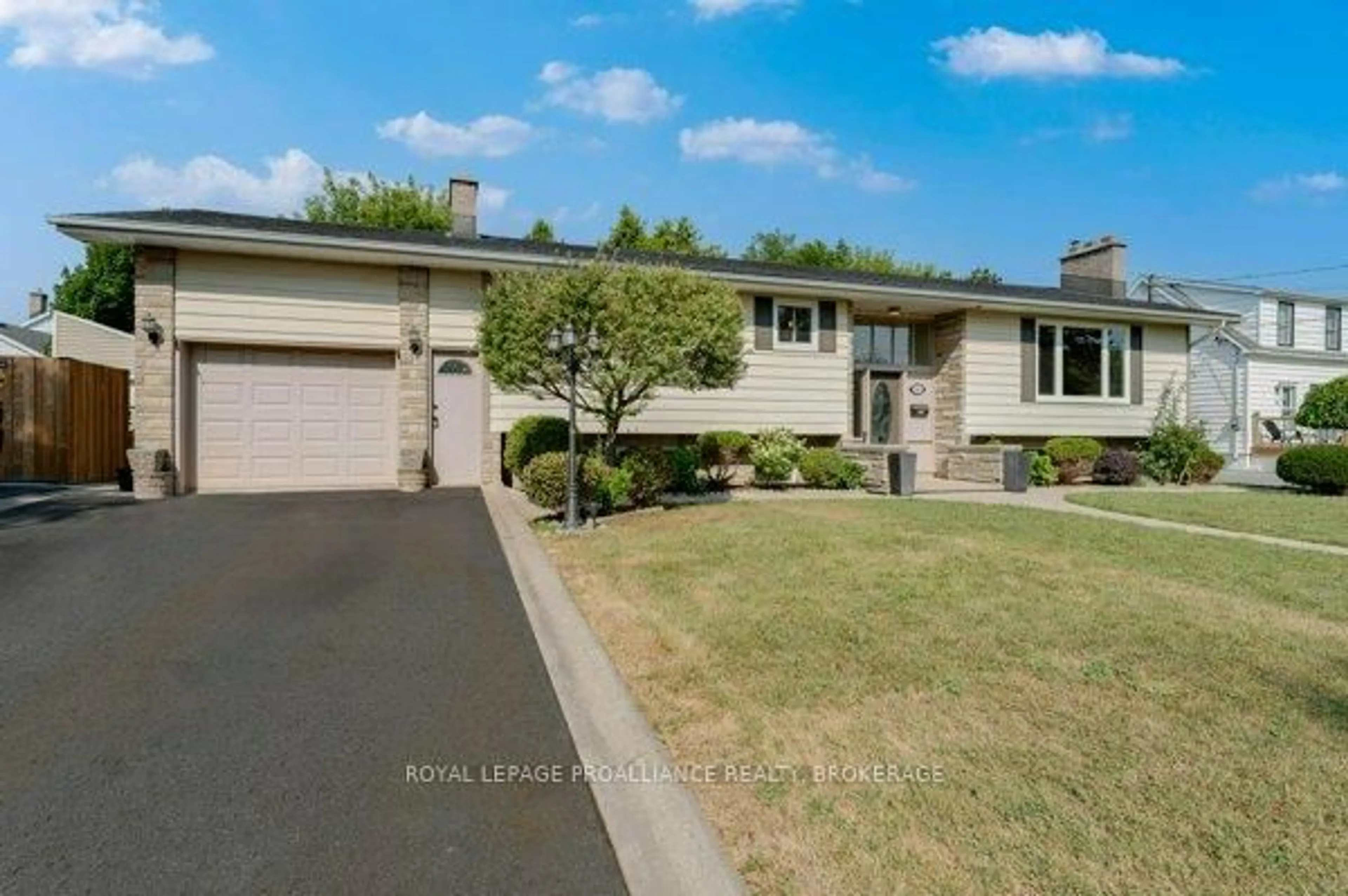 Home with vinyl exterior material, street for 14 Baker St, Kingston Ontario K7K 4Z3