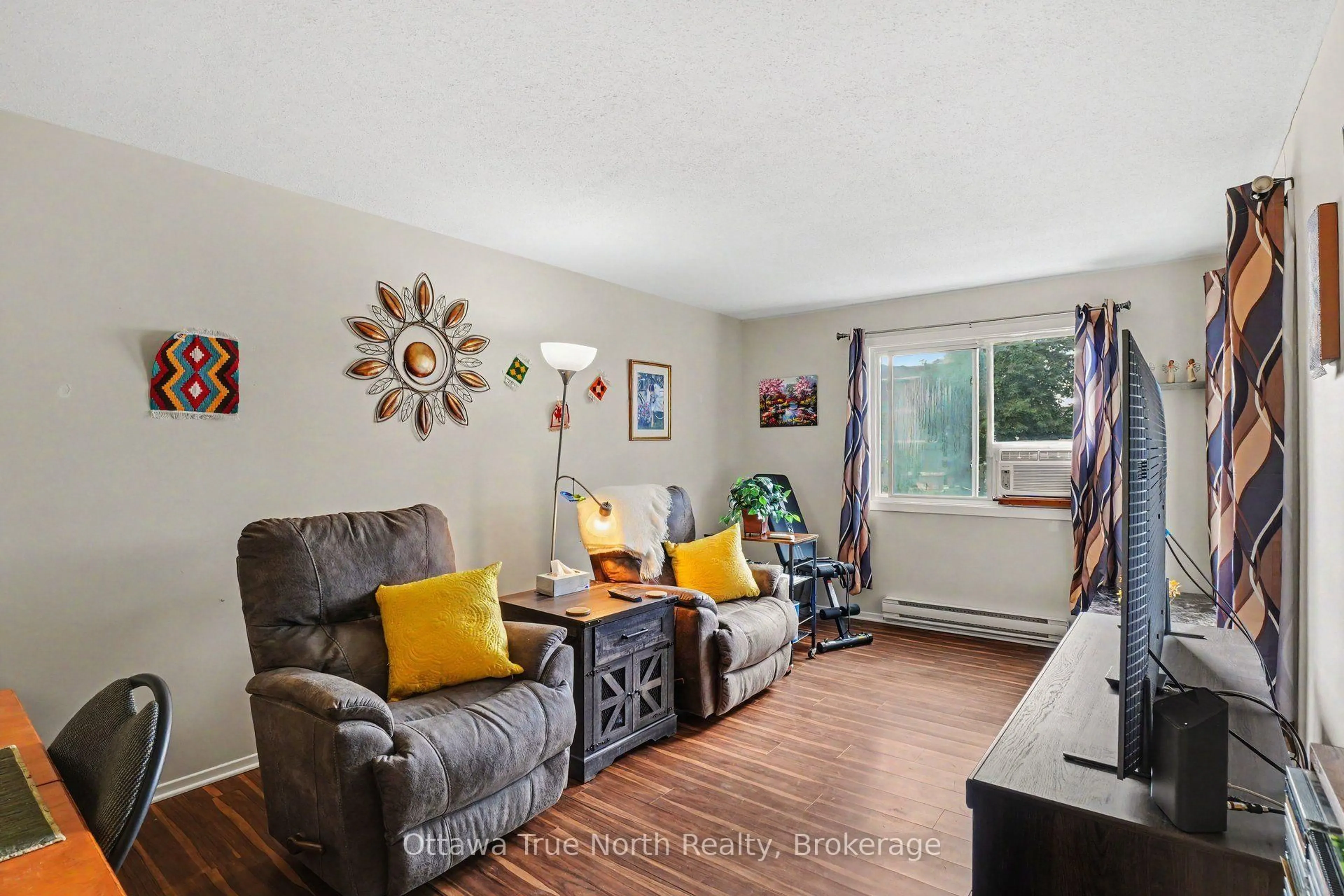 Living room with furniture, unknown for 212 Viewmount Dr #218, Ottawa Ontario K2E 7X2