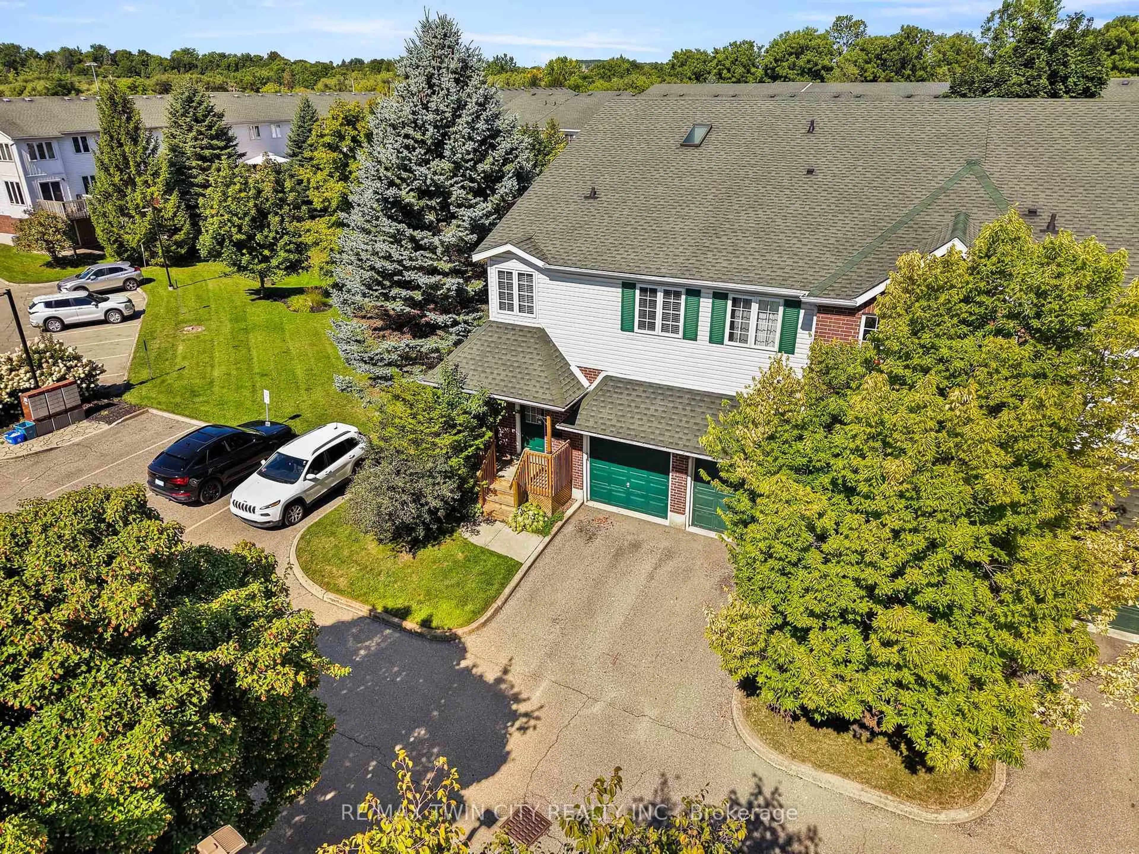 A pic from outside/outdoor area/front of a property/back of a property/a pic from drone, street for 42 Green Valley Dr #65, Kitchener Ontario N2P 2J7