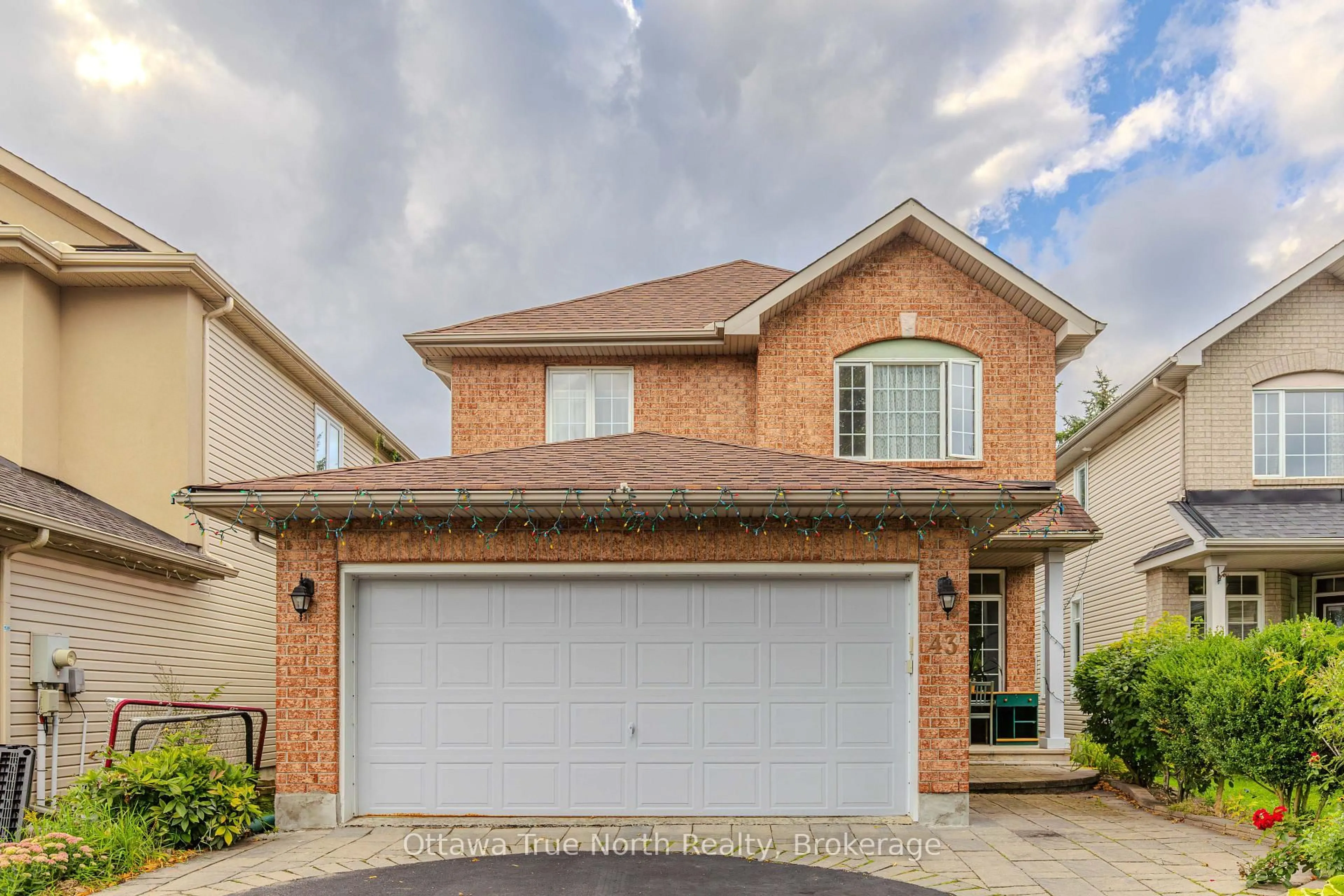 Home with brick exterior material, street for 43 Evanshen Cres, Ottawa Ontario K2K 2Z7