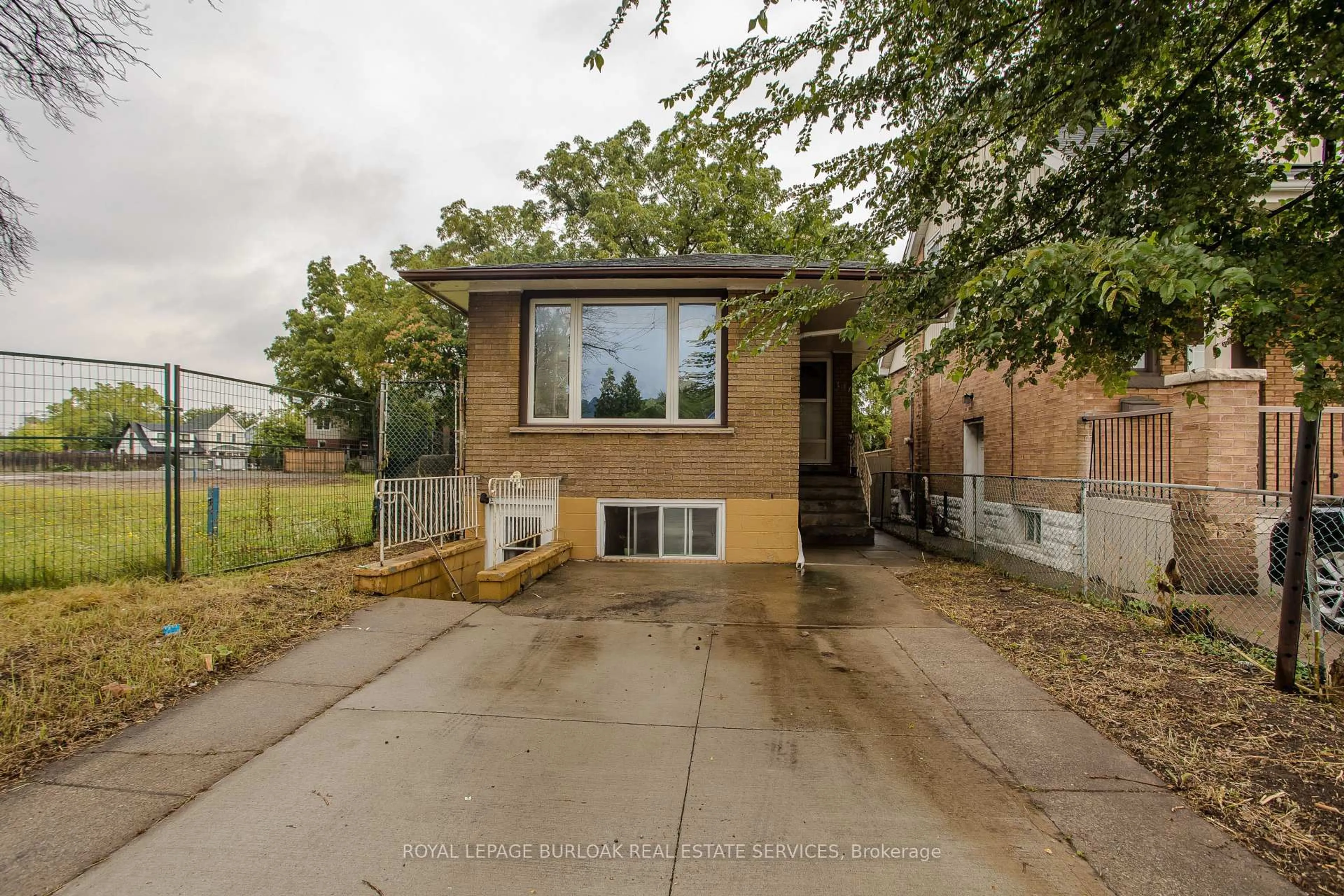 Home with brick exterior material, street for 307 Dunsmure Rd, Hamilton Ontario L8L 1X1