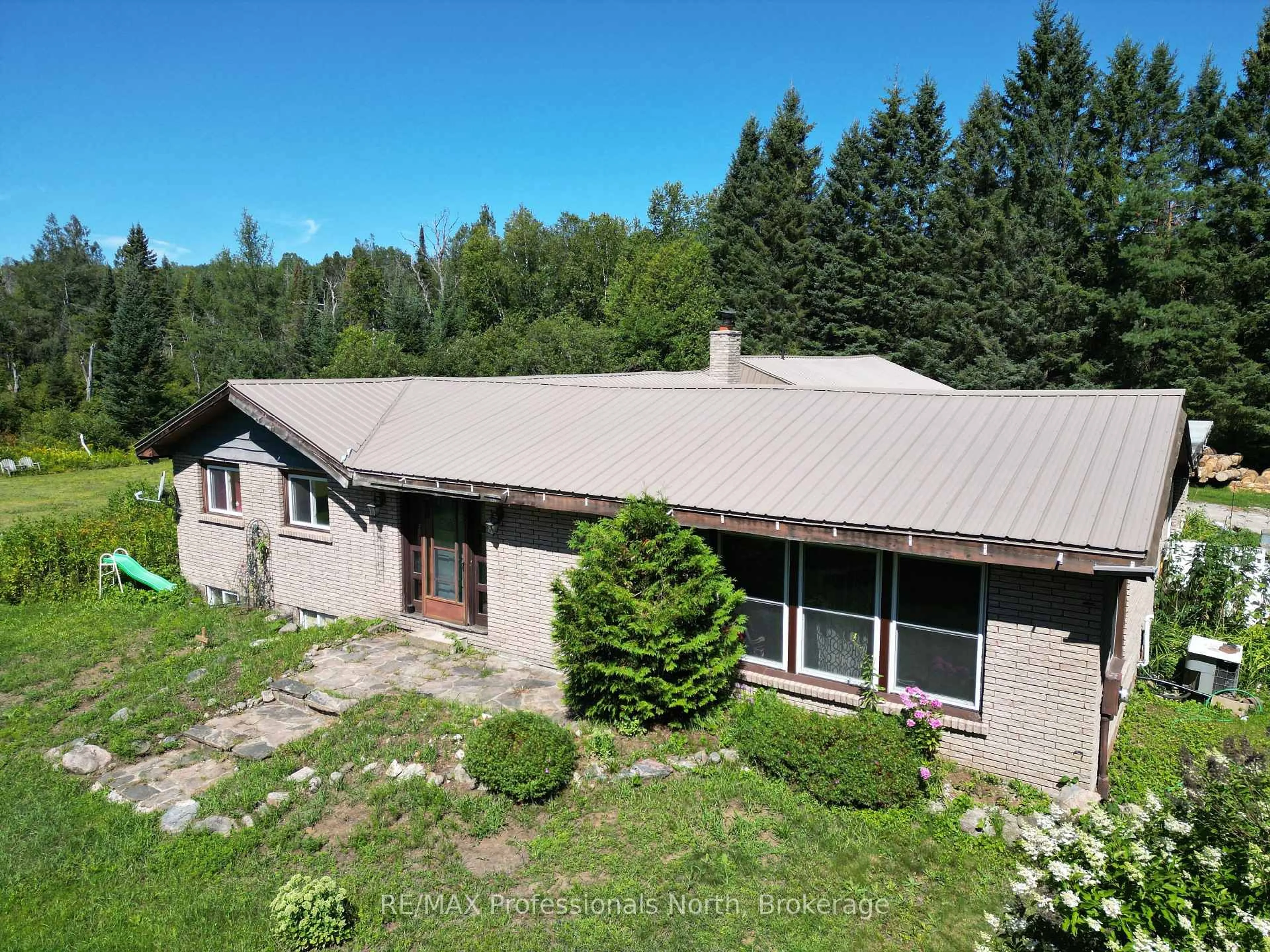 A pic from outside/outdoor area/front of a property/back of a property/a pic from drone, building for 8111 County Road 503, Minden Hills Ontario K0M 2A1