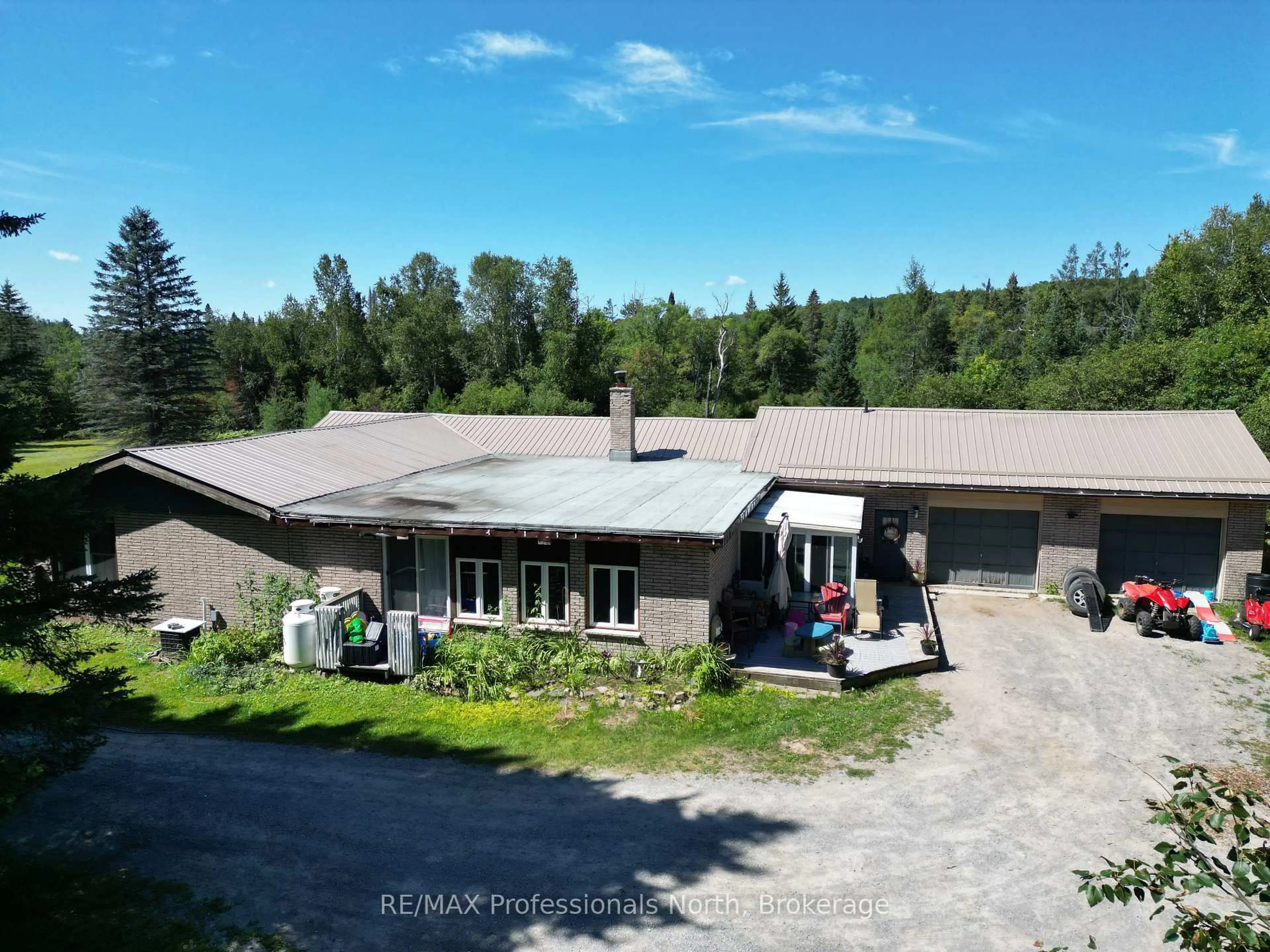 A pic from outside/outdoor area/front of a property/back of a property/a pic from drone, building for 8111 County Road 503, Minden Hills Ontario K0M 2A1