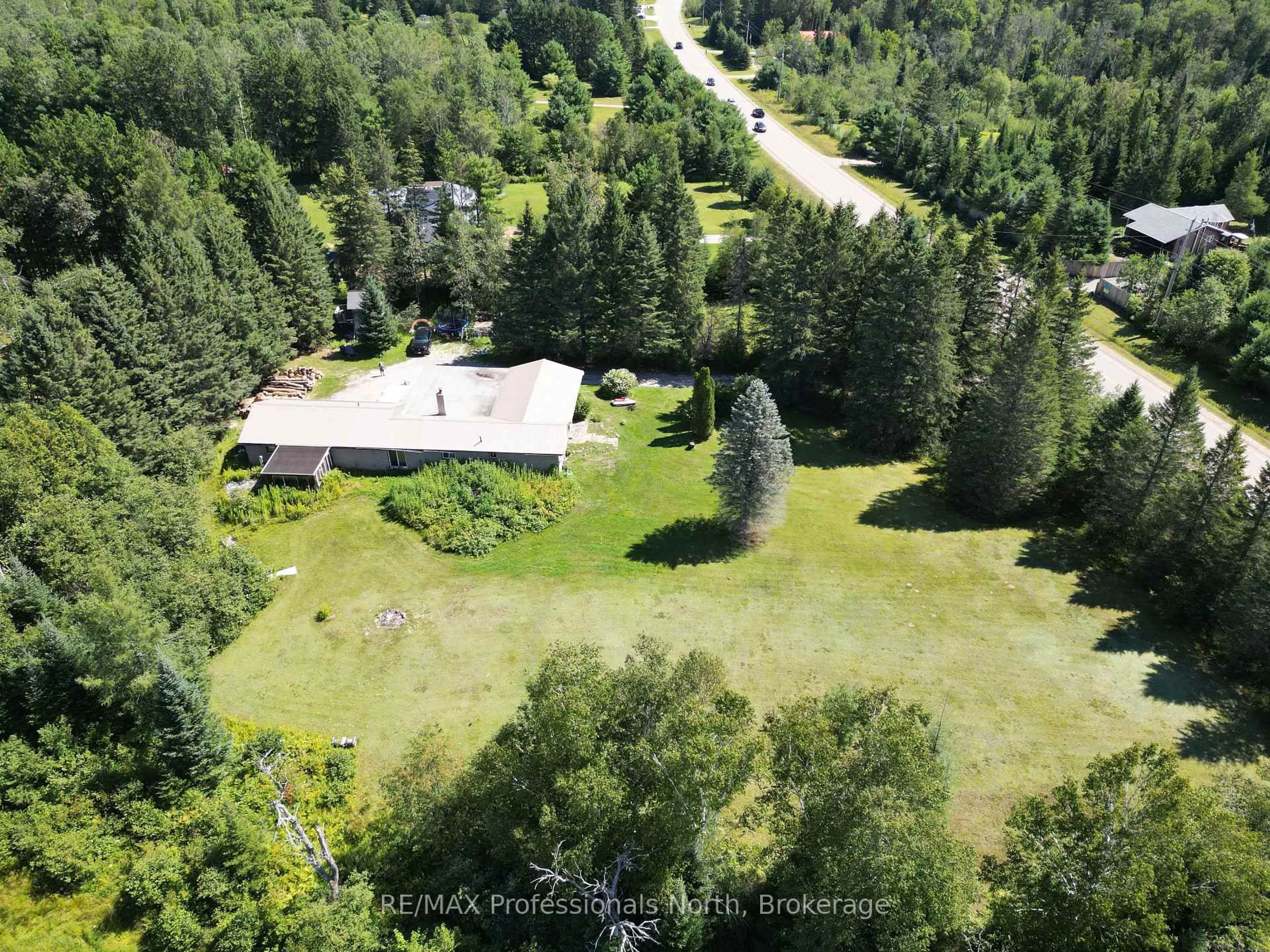 A pic from outside/outdoor area/front of a property/back of a property/a pic from drone, forest/trees view for 8111 County Road 503, Minden Hills Ontario K0M 2A1