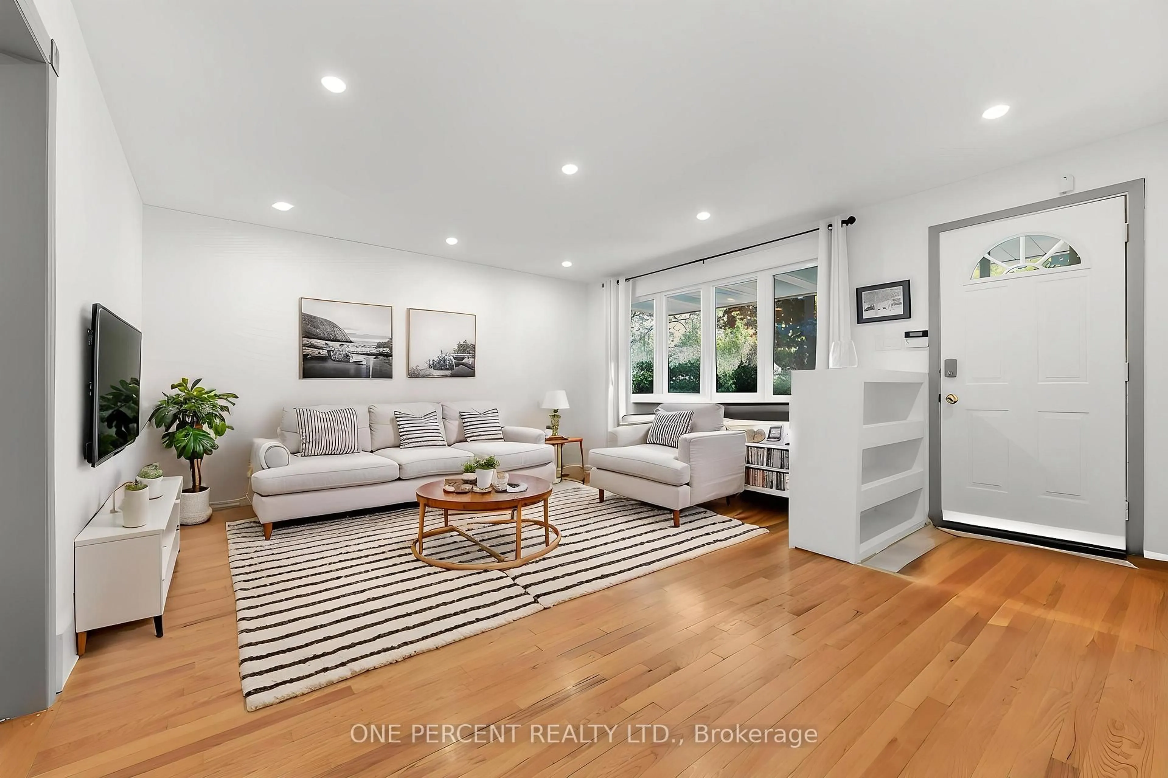 Living room with furniture, wood/laminate floor for 933 Kincaid Crt #Unit A and Unit B, Ottawa Ontario K1V 6N7
