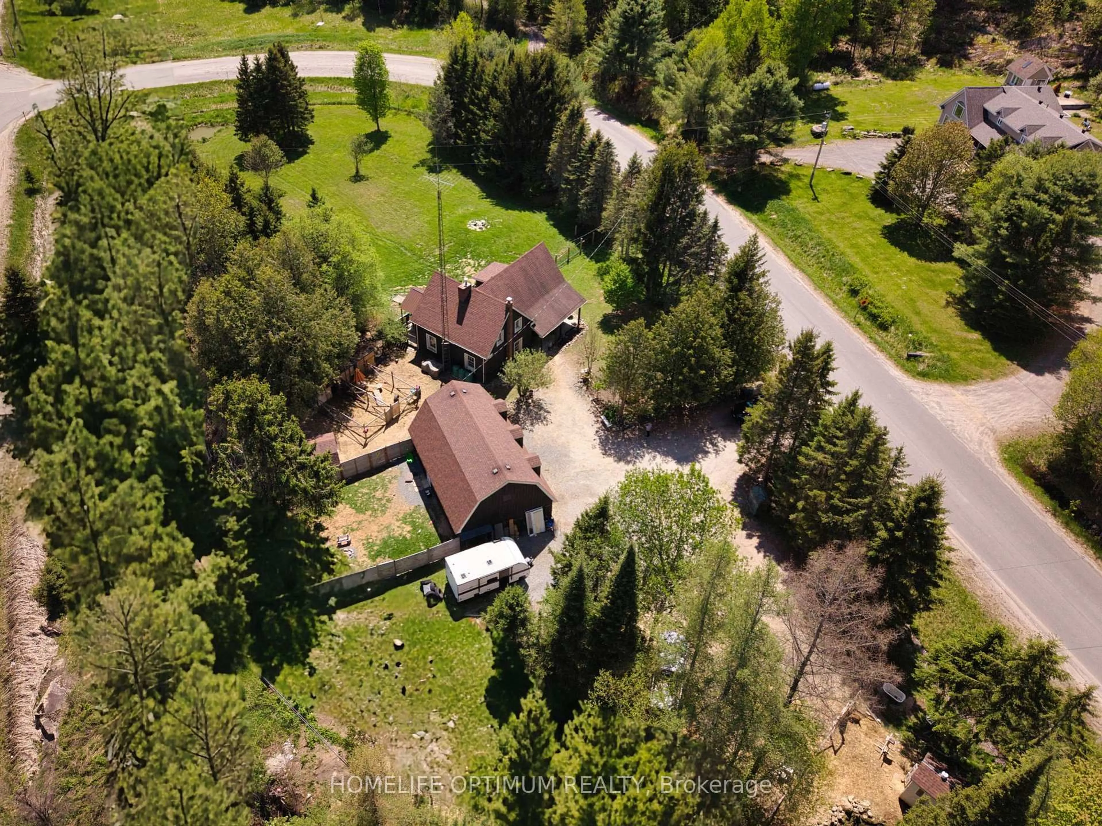 A pic from outside/outdoor area/front of a property/back of a property/a pic from drone, forest/trees view for 41 Allensville Rd, Huntsville Ontario P0B 1M0