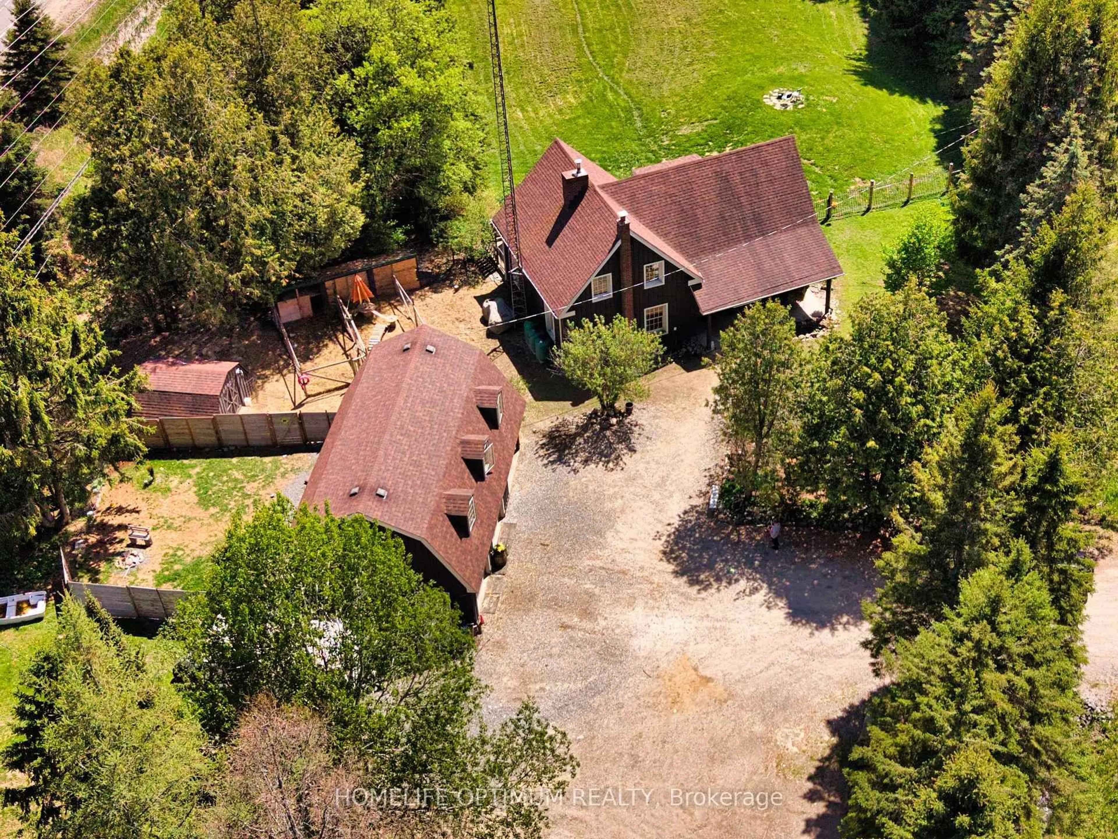A pic from outside/outdoor area/front of a property/back of a property/a pic from drone, forest/trees view for 41 Allensville Rd, Huntsville Ontario P0B 1M0