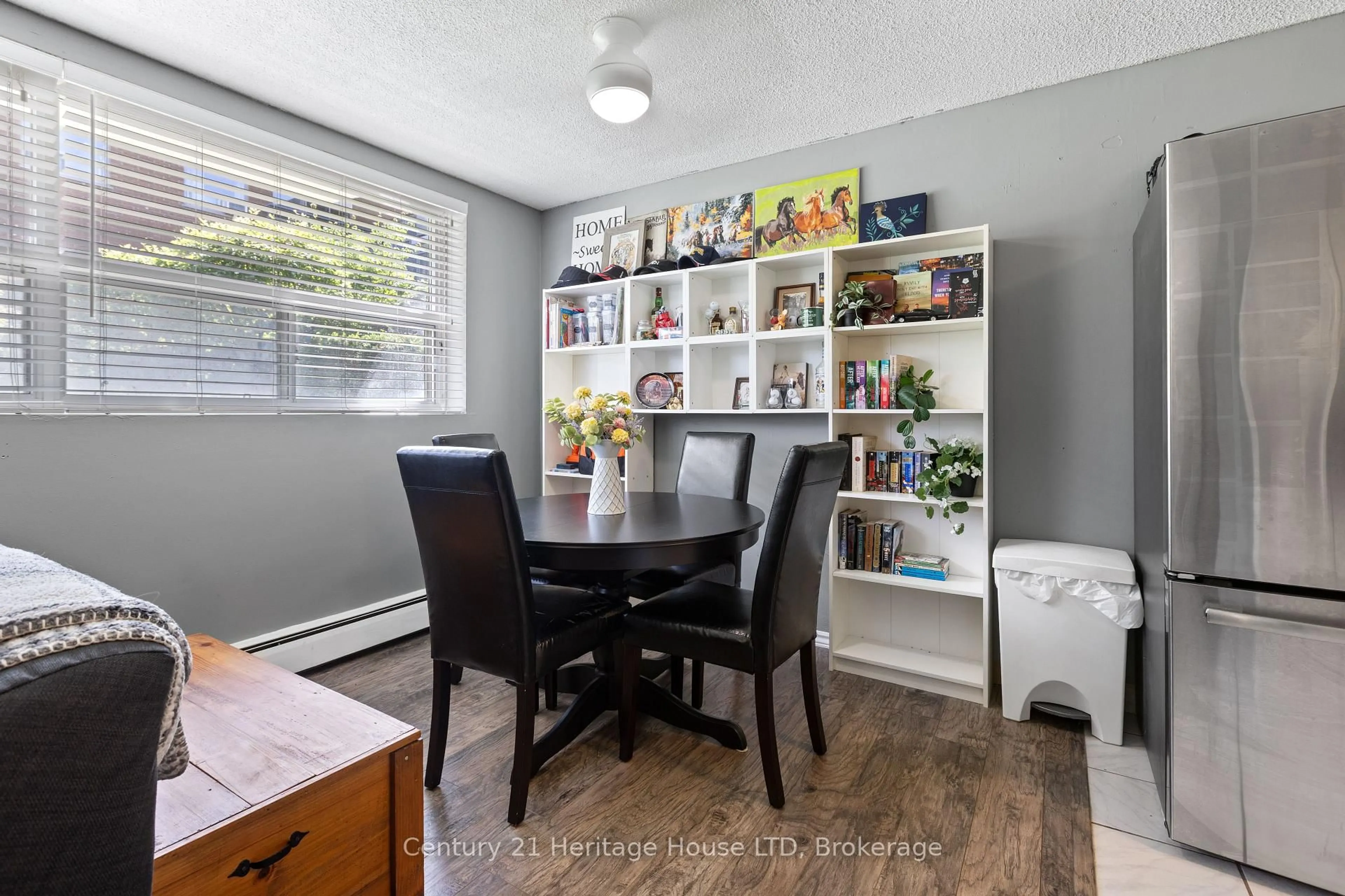 Dining room, wood/laminate floor for 242 Oakdale Ave #109, St. Catharines Ontario L2P 3K5