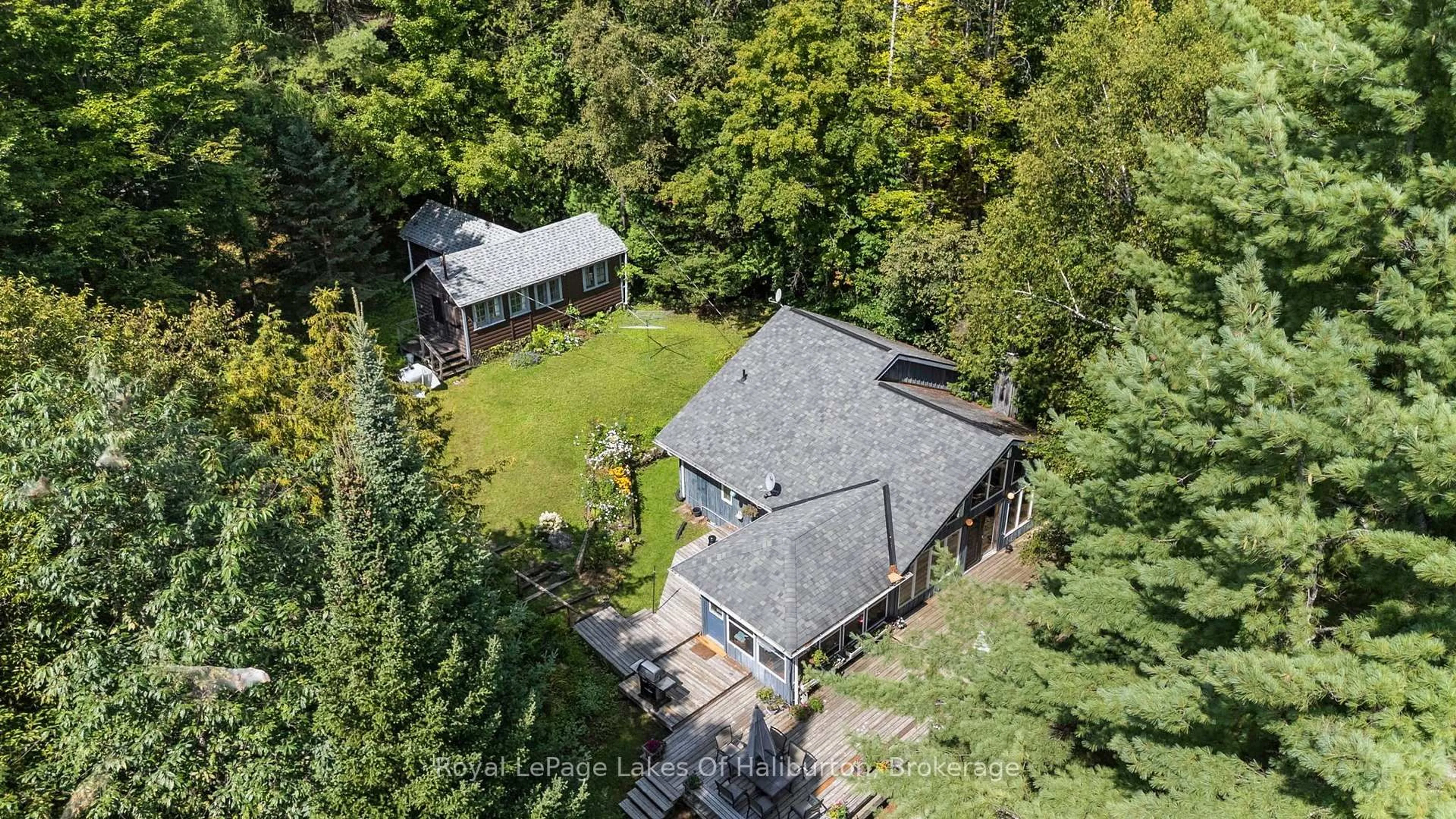 A pic from outside/outdoor area/front of a property/back of a property/a pic from drone, unknown for 1035 Triple Creek Lane, Algonquin Highlands Ontario K0M 1S0