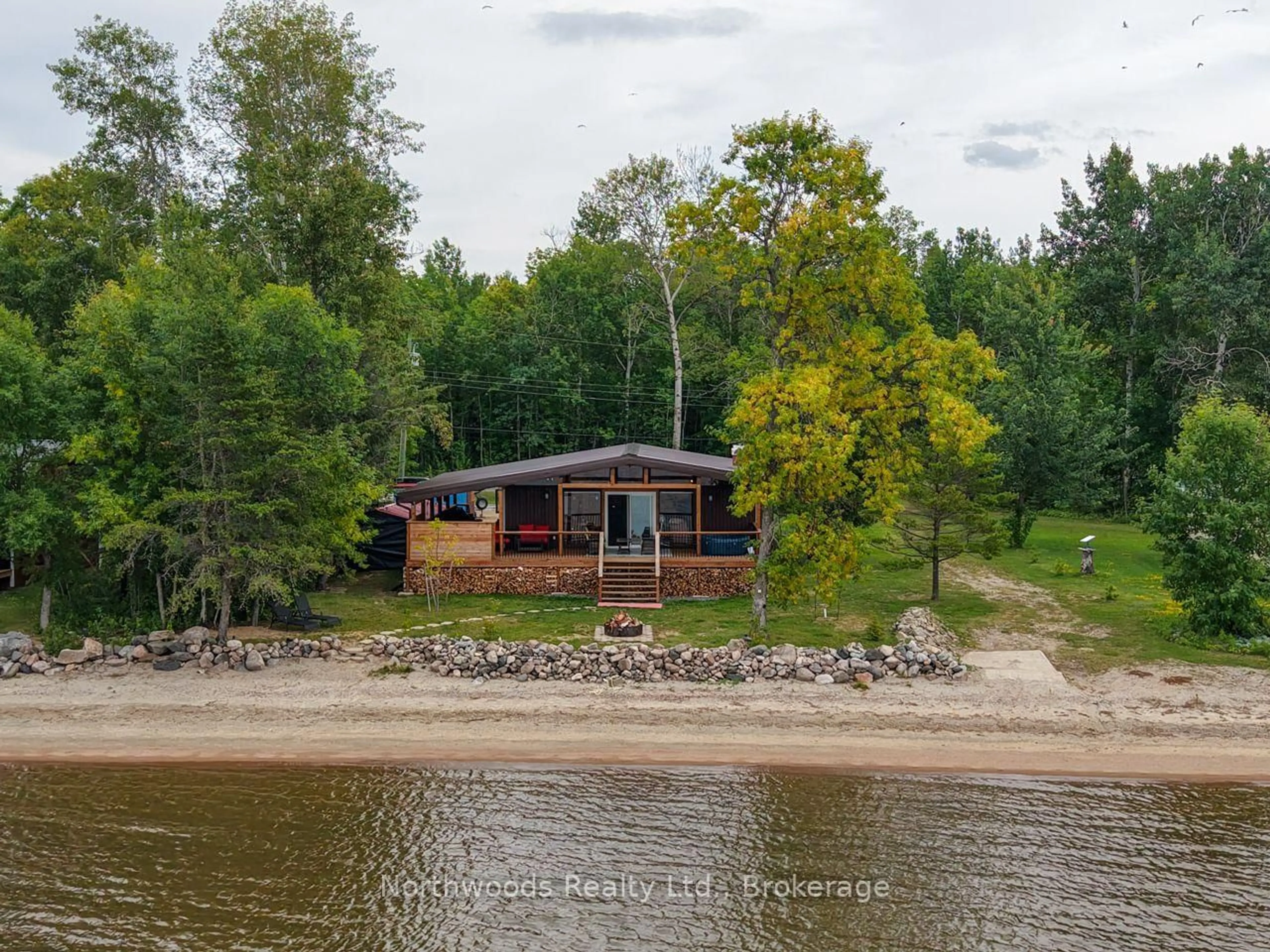 A pic from outside/outdoor area/front of a property/back of a property/a pic from drone, water/lake/river/ocean view for 93 Mosbeck Rd, Lake of the Woods Ontario P0W 1J0