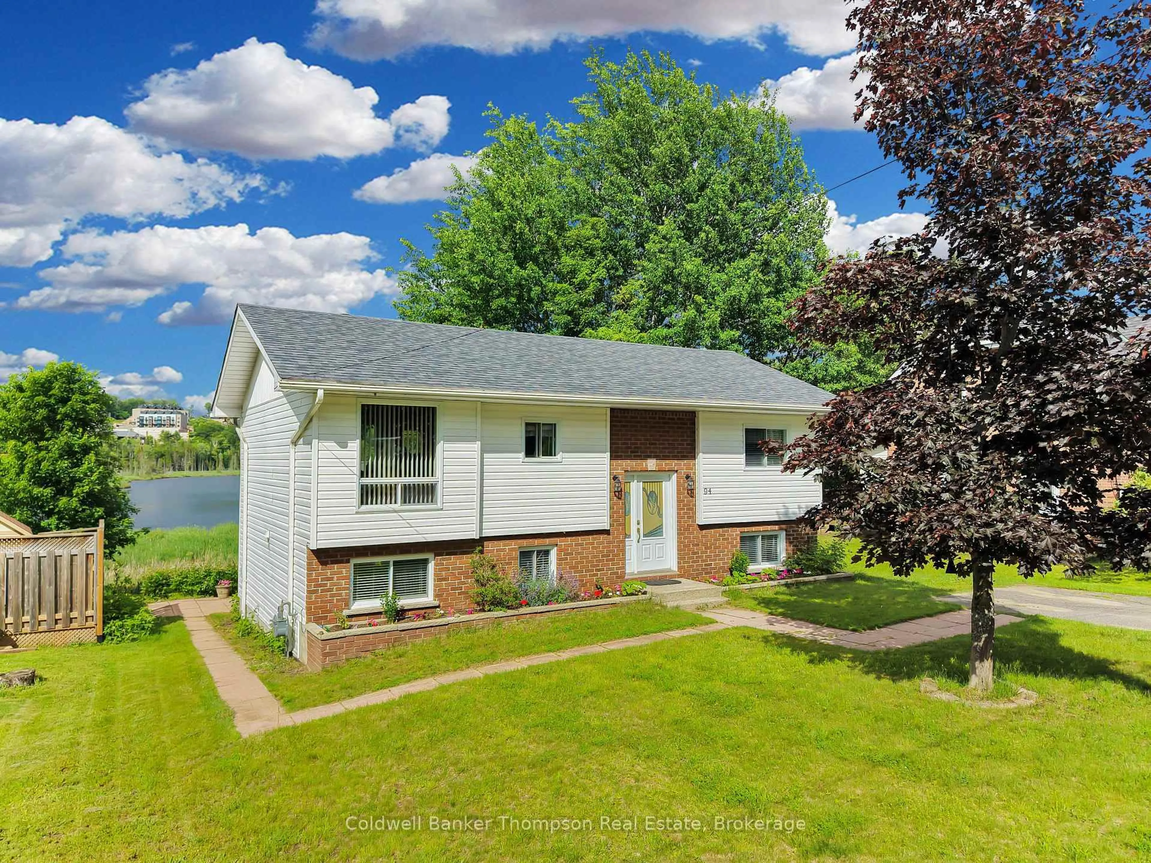 A pic from outside/outdoor area/front of a property/back of a property/a pic from drone, water/lake/river/ocean view for 94 Brunel Rd, Huntsville Ontario P1H 1R1