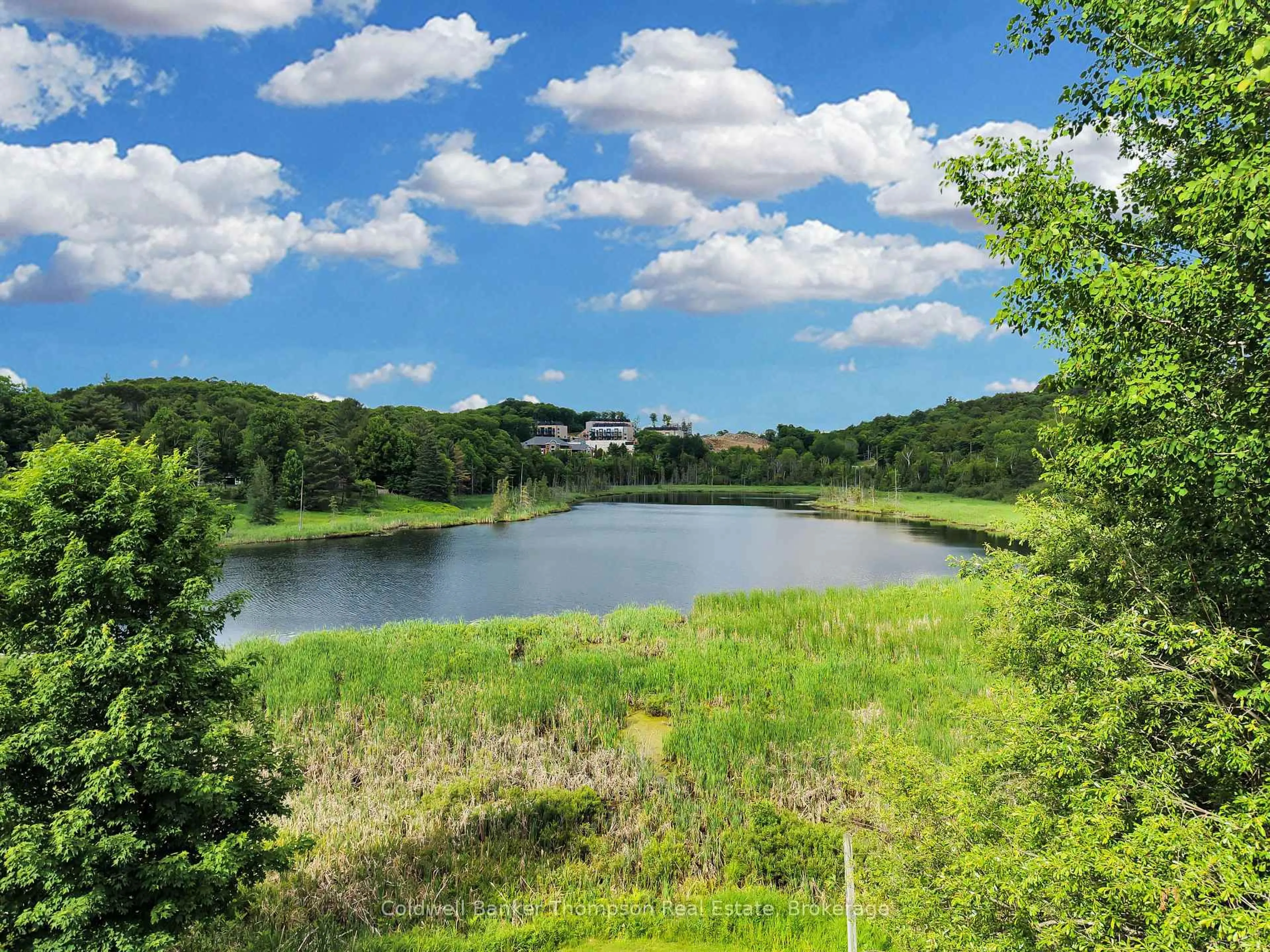 A pic from outside/outdoor area/front of a property/back of a property/a pic from drone, water/lake/river/ocean view for 94 Brunel Rd, Huntsville Ontario P1H 1R1