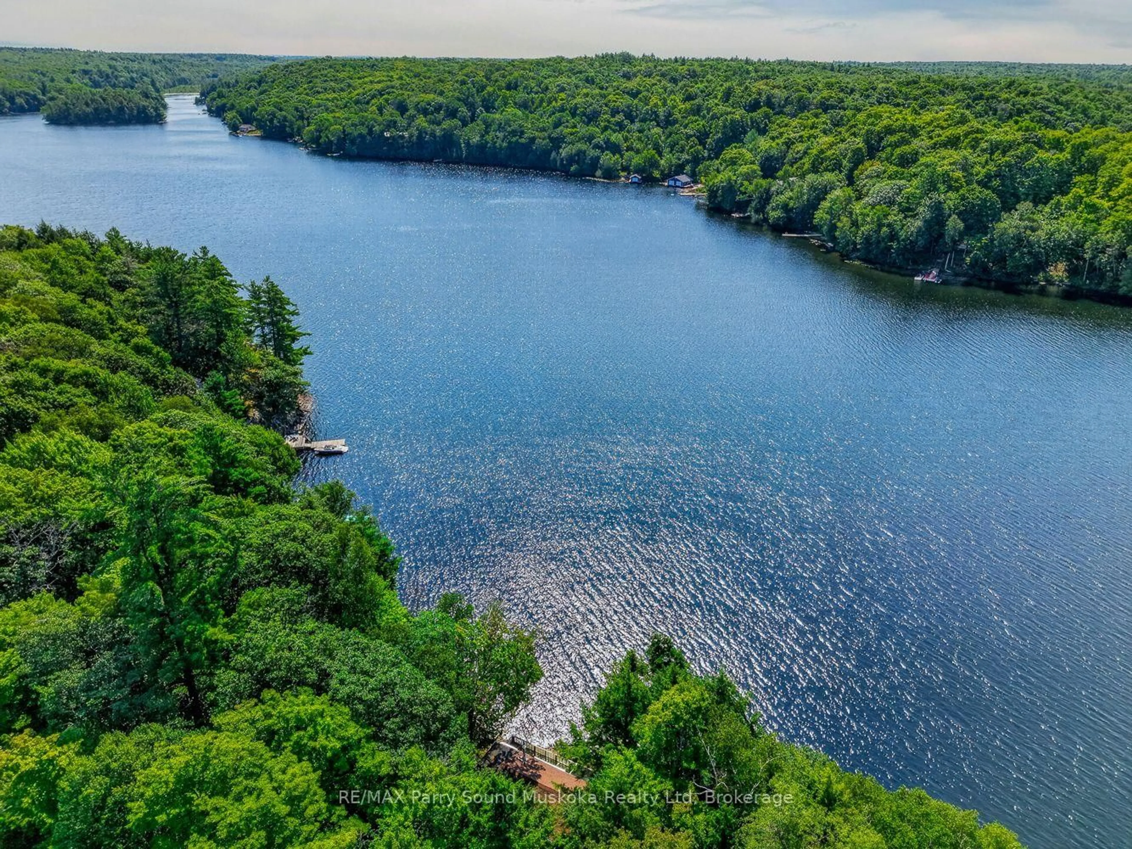 A pic from outside/outdoor area/front of a property/back of a property/a pic from drone, water/lake/river/ocean view for 87 Millies Rd, Seguin Ontario P2A 2W8