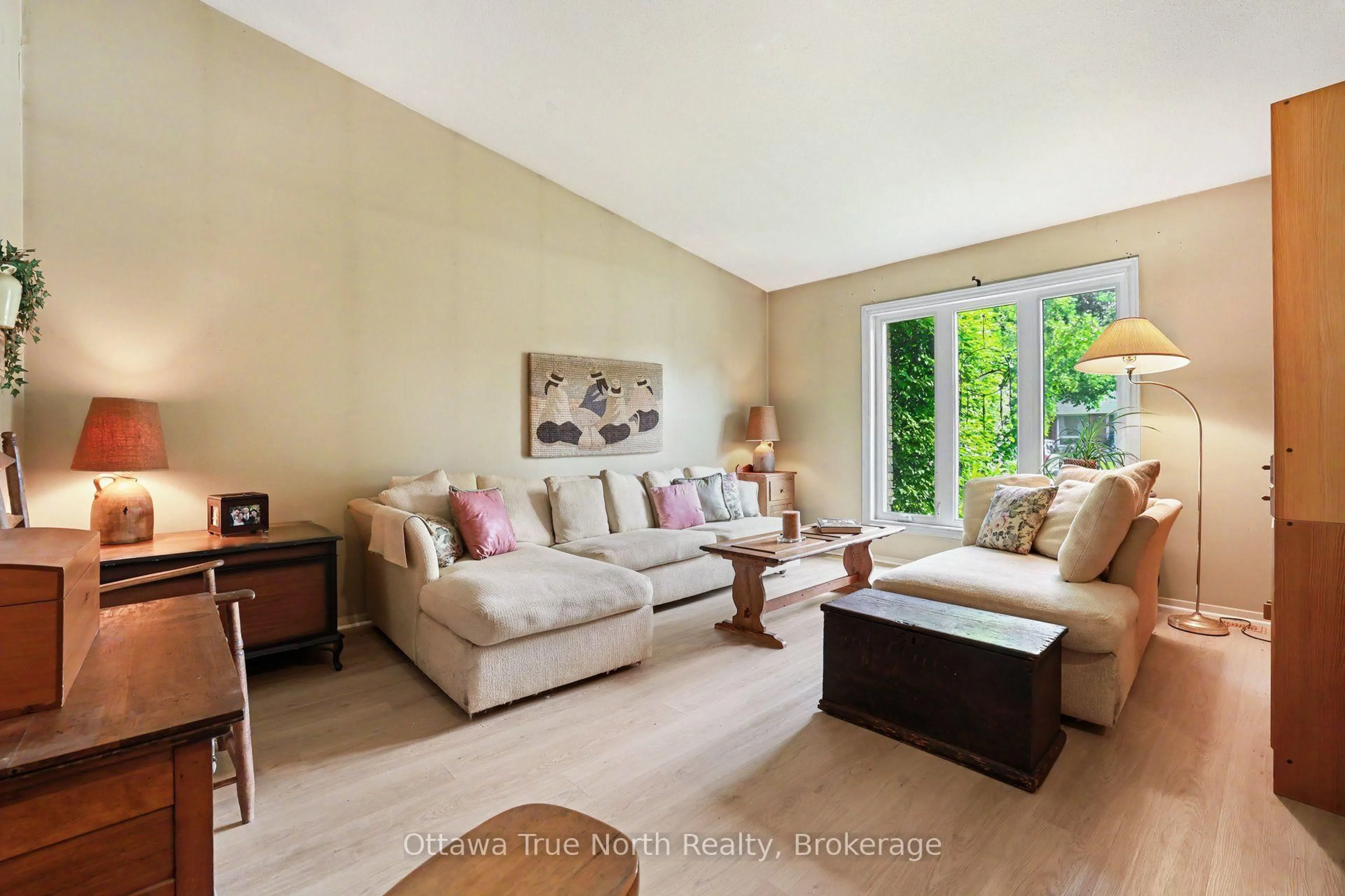 Living room with furniture, wood/laminate floor for 41 Aldgate Cres, Ottawa Ontario K2J 2C8