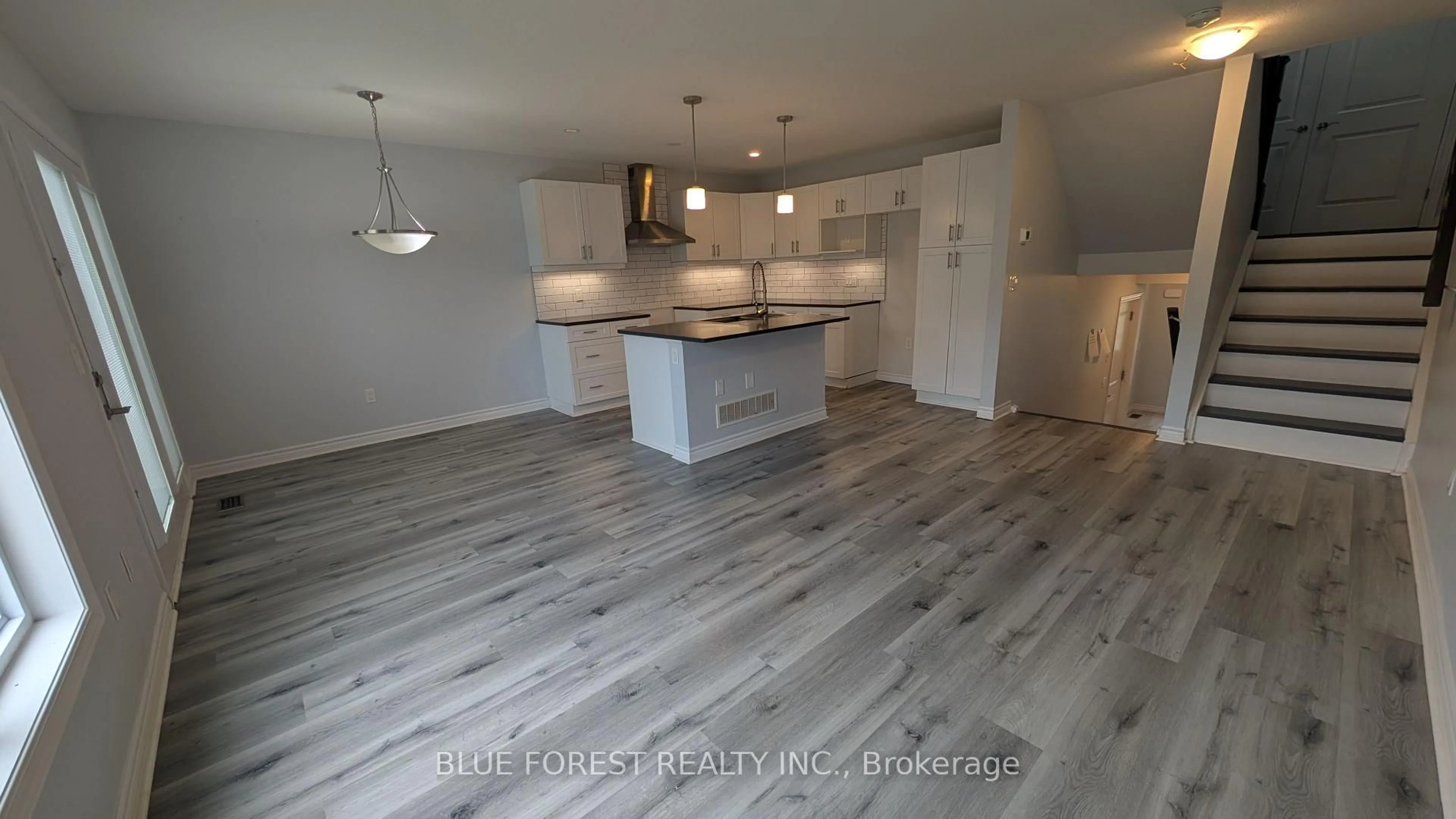 Open concept kitchen, wood/laminate floor for 3400 Castle Rock Pl #104, London South Ontario N6L 0E4