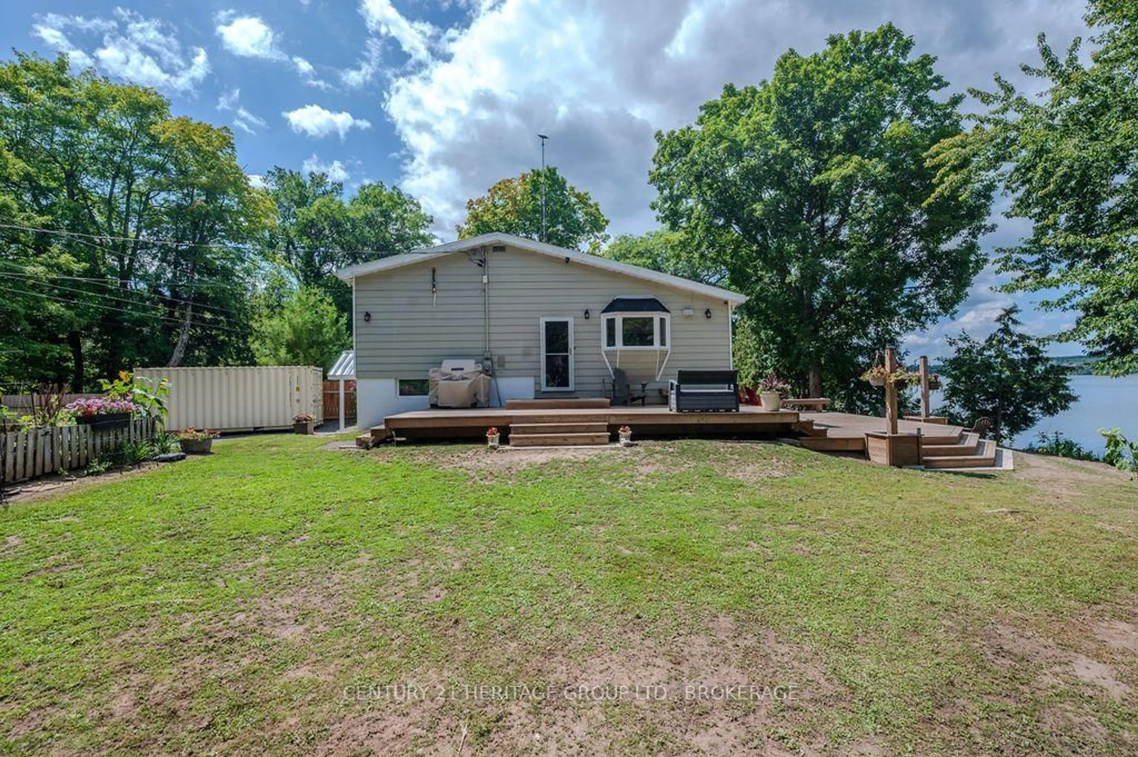 A pic from outside/outdoor area/front of a property/back of a property/a pic from drone, water/lake/river/ocean view for 1127 Perry Lane, Sydenham Ontario K0H 2T0