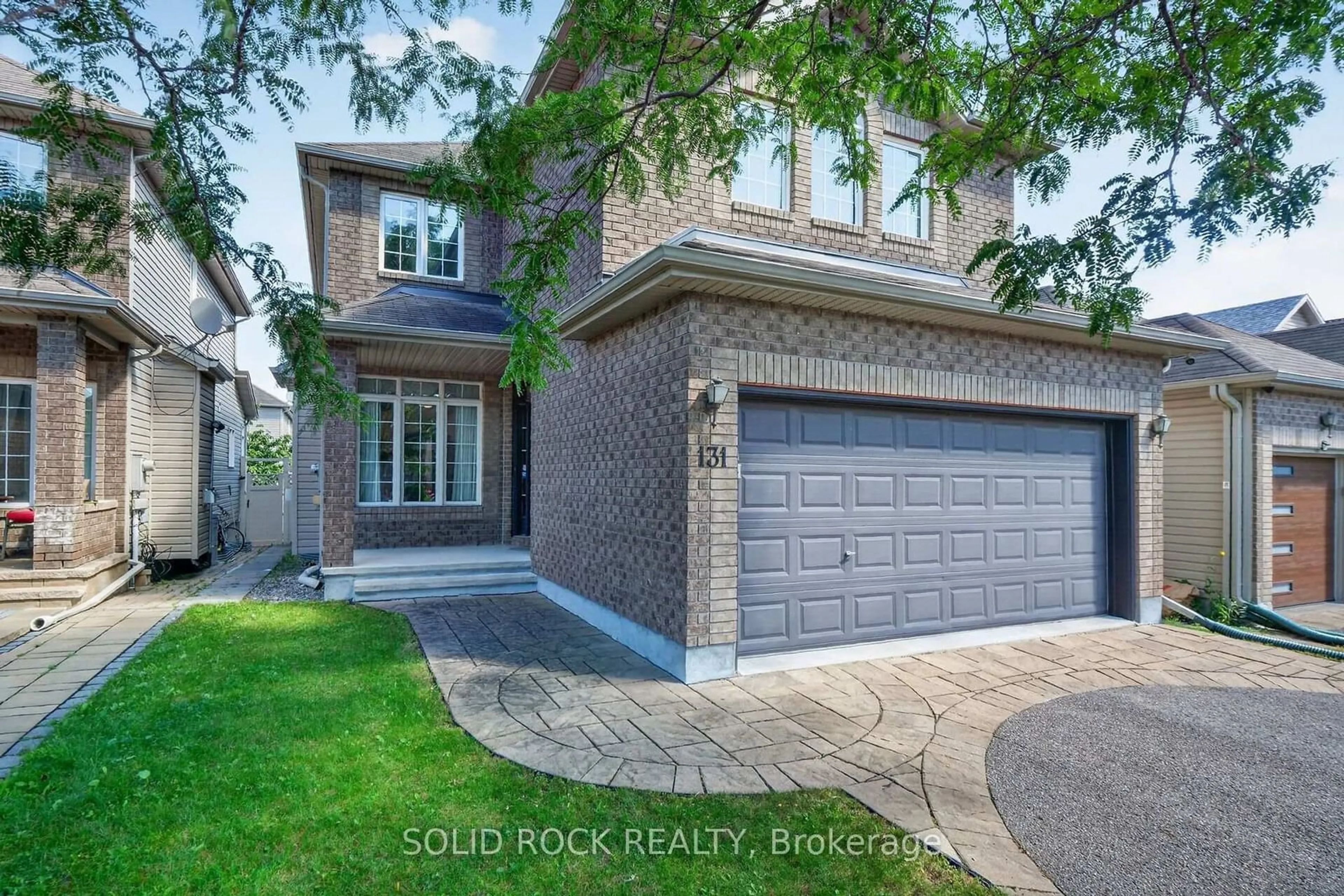 Home with brick exterior material, street for 131 Finn Crt, Ottawa Ontario K1V 2C6