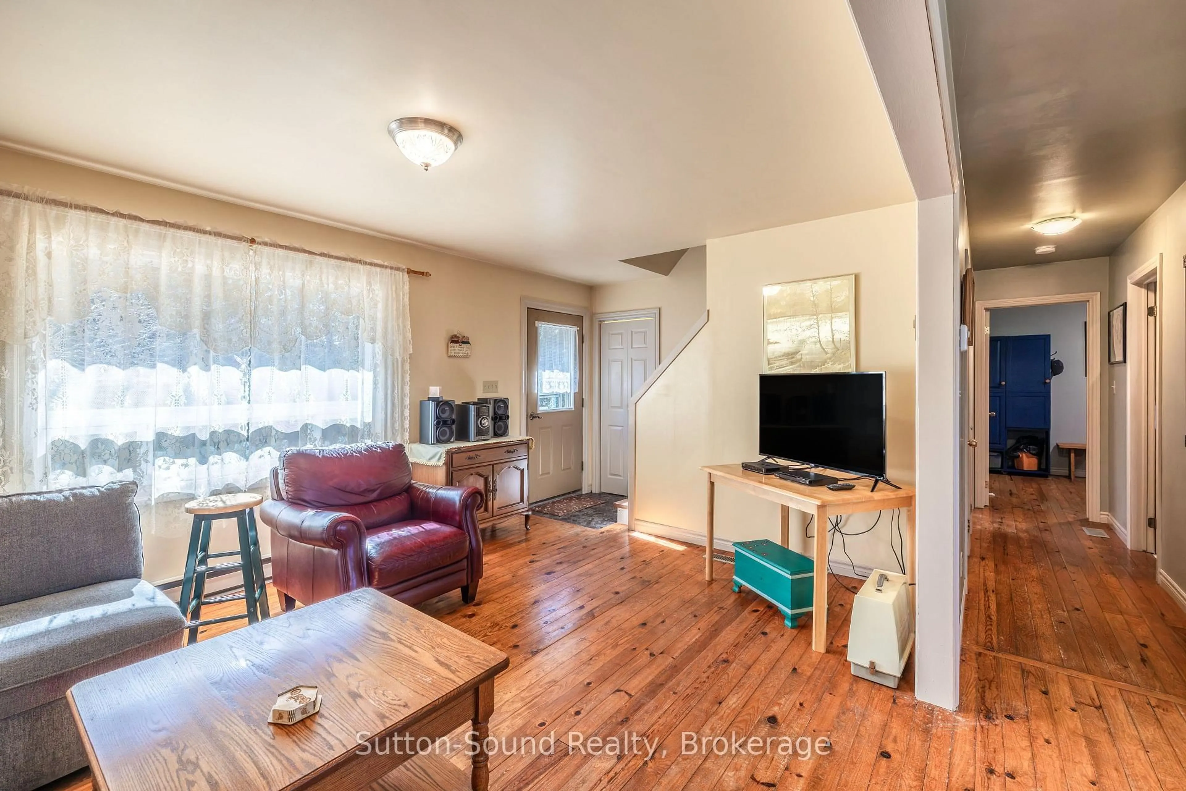 Living room with furniture, wood/laminate floor for 350222 Bayshore Rd, Meaford Ontario N0H 1B0