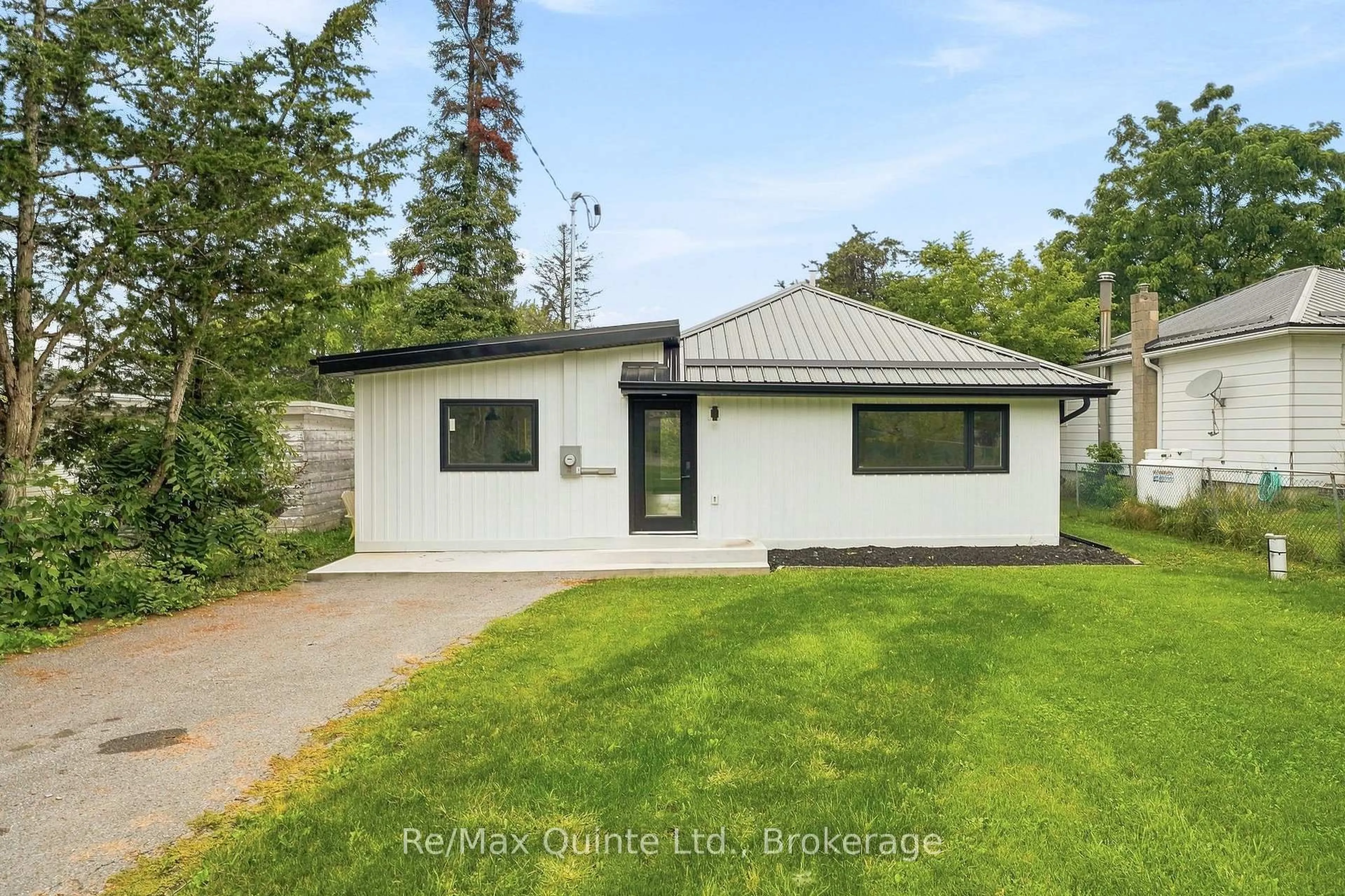 Home with vinyl exterior material, street for 417 County Road 28, Prince Edward County Ontario K8P 3J1