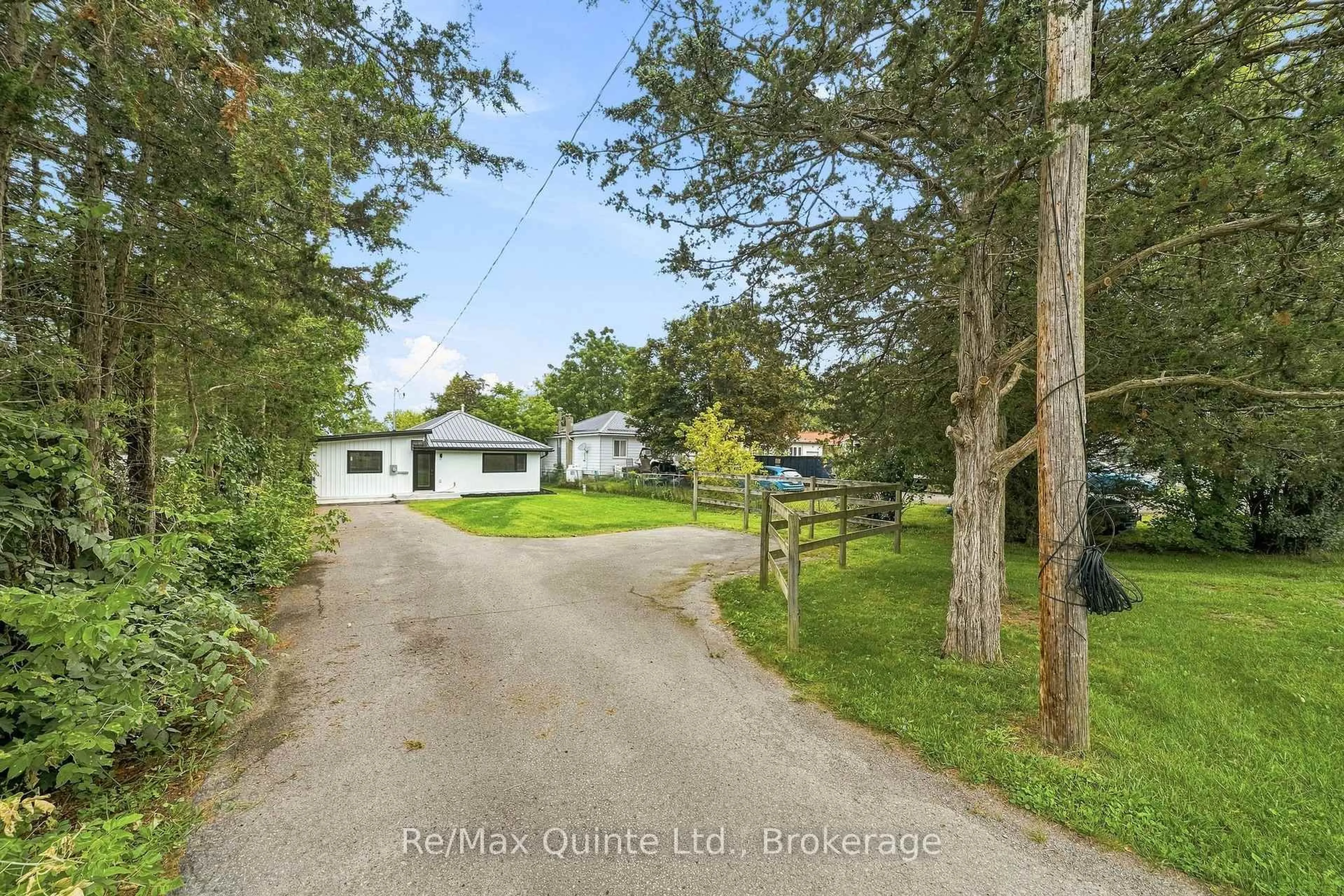 A pic from outside/outdoor area/front of a property/back of a property/a pic from drone, water/lake/river/ocean view for 417 County Road 28, Prince Edward County Ontario K8P 3J1