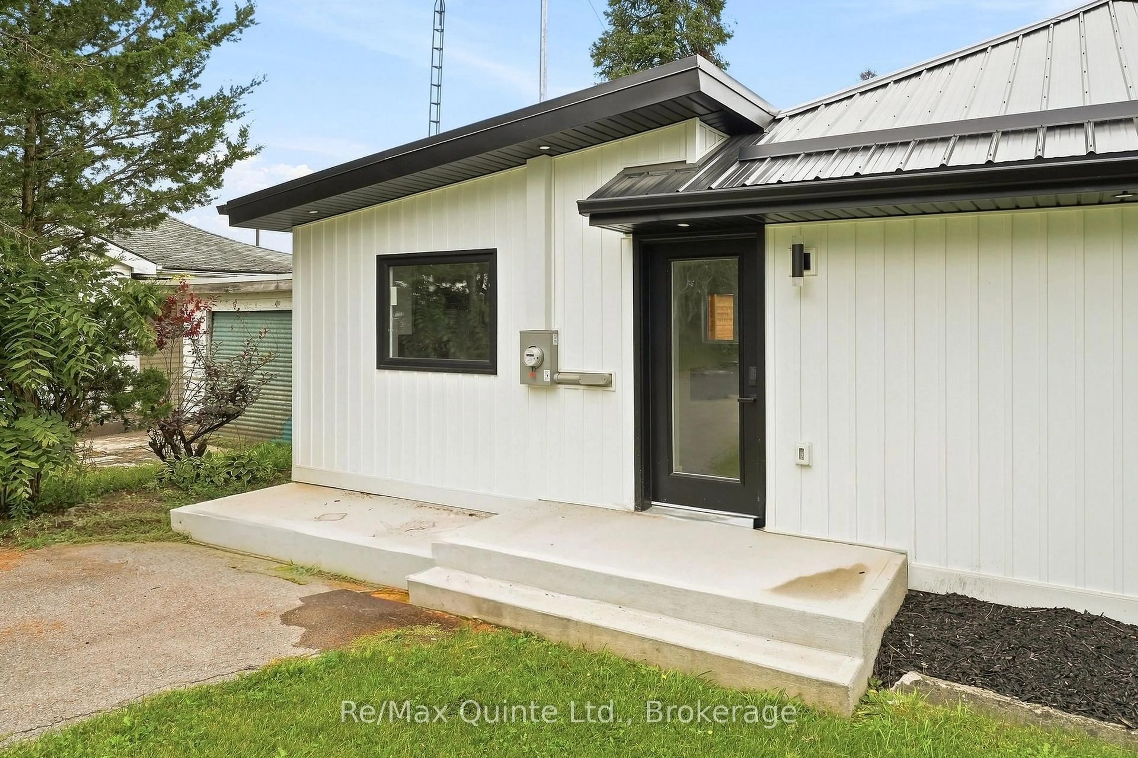 Home with vinyl exterior material, street for 417 County Road 28, Prince Edward County Ontario K8P 3J1
