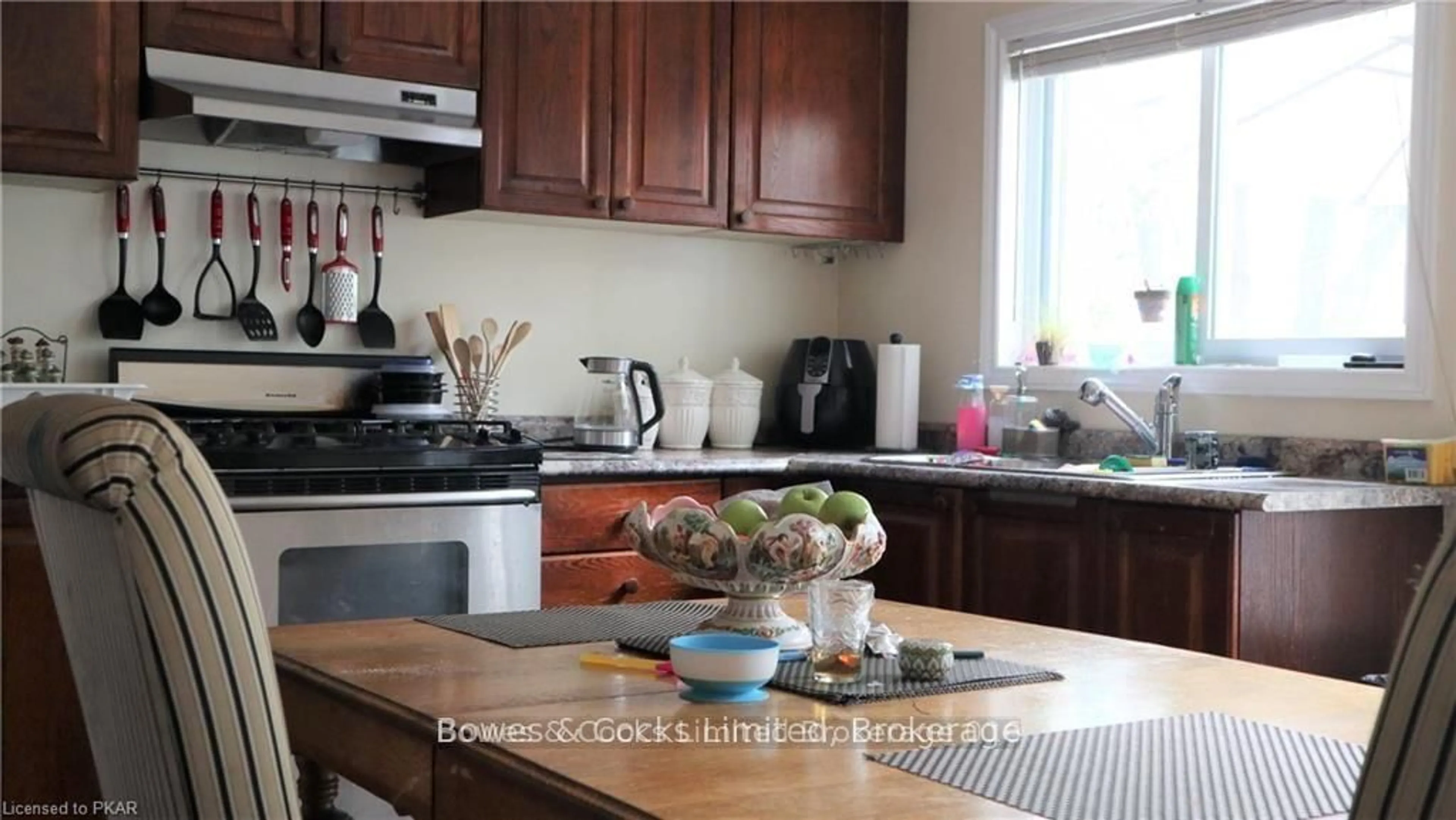 Open concept kitchen, wood/laminate floor for 103 QUEEN St, Trent Hills Ontario K0L 1L0