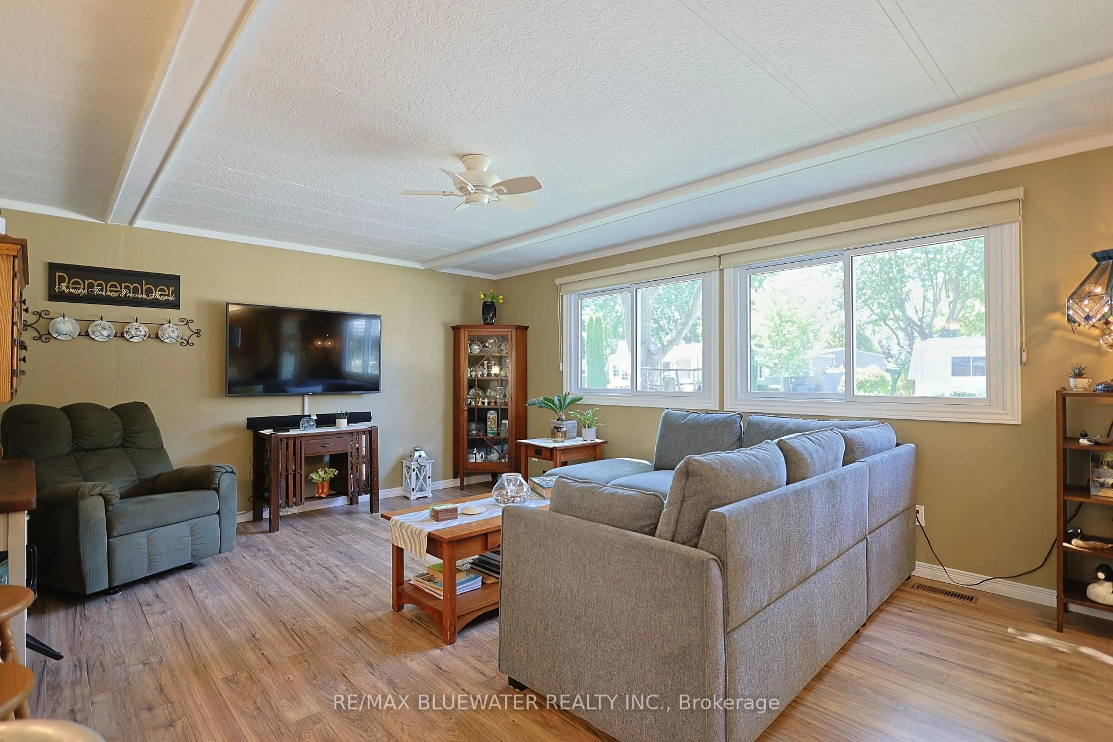 Living room with furniture, wood/laminate floor for 95 Shannon Blvd, South Huron Ontario N0M 1T0