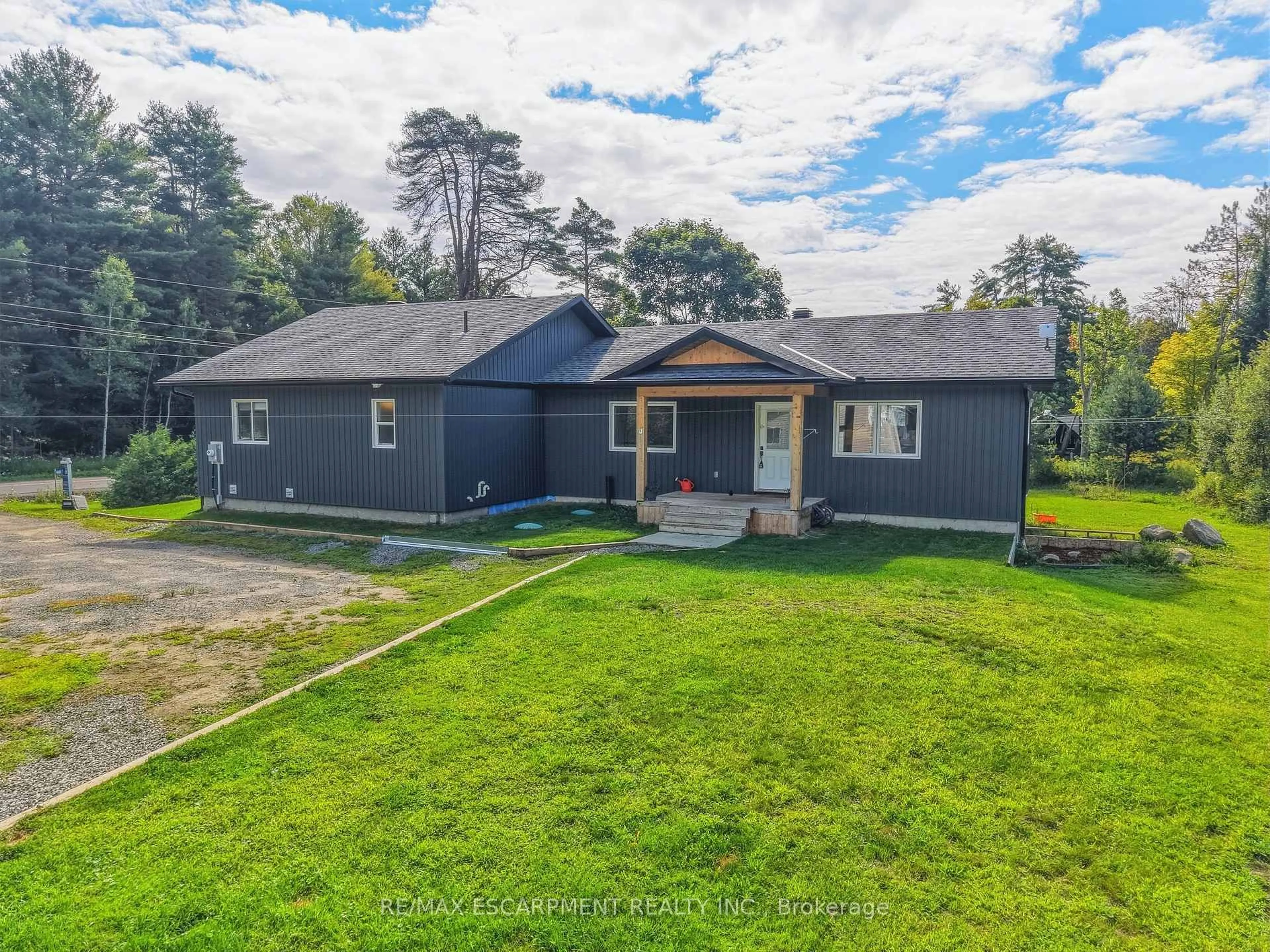 A pic from outside/outdoor area/front of a property/back of a property/a pic from drone, street for 400 Raymond Rd, Muskoka Lakes Ontario P1L 1X4