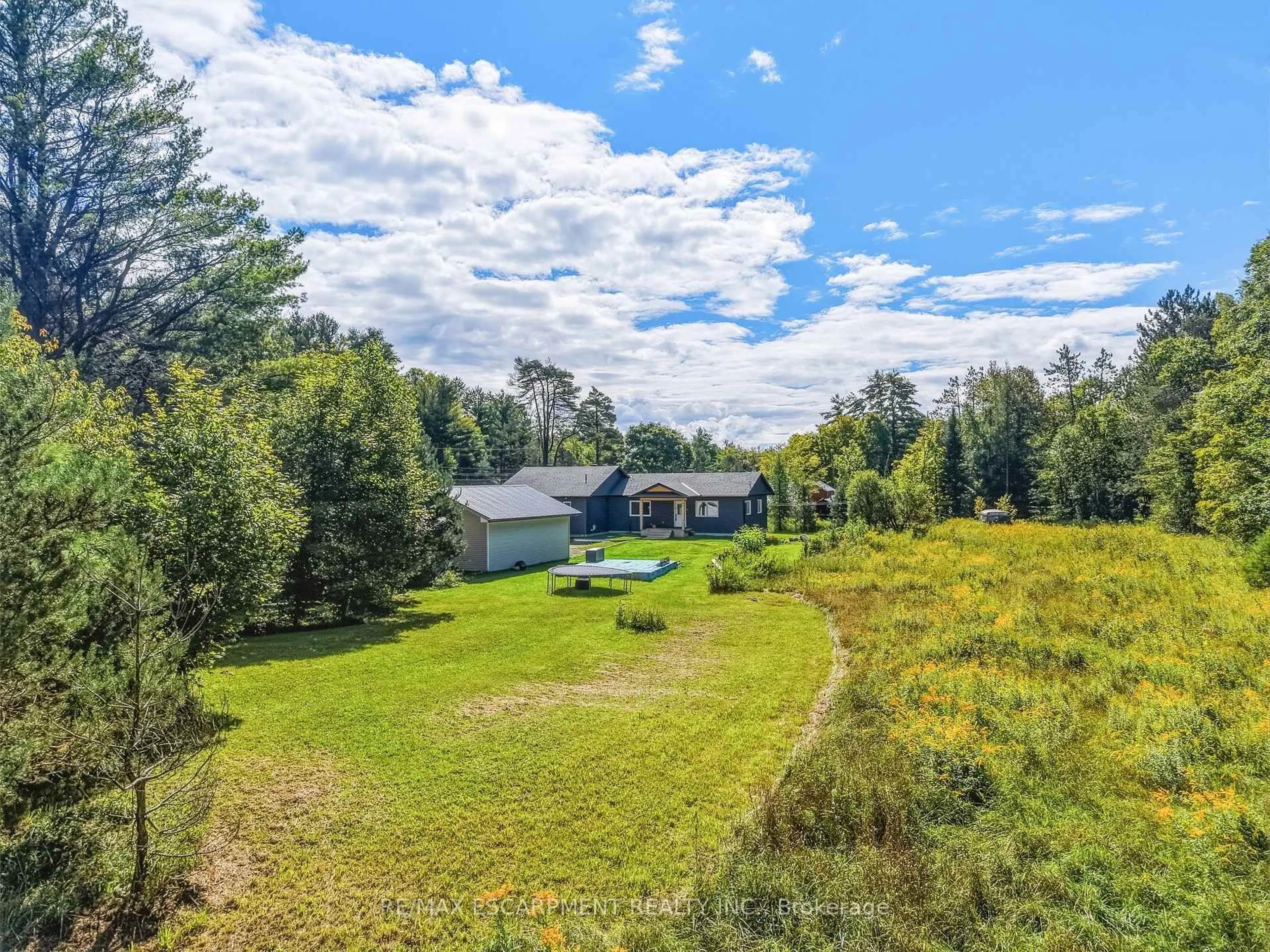 A pic from outside/outdoor area/front of a property/back of a property/a pic from drone, water/lake/river/ocean view for 400 Raymond Rd, Muskoka Lakes Ontario P1L 1X4