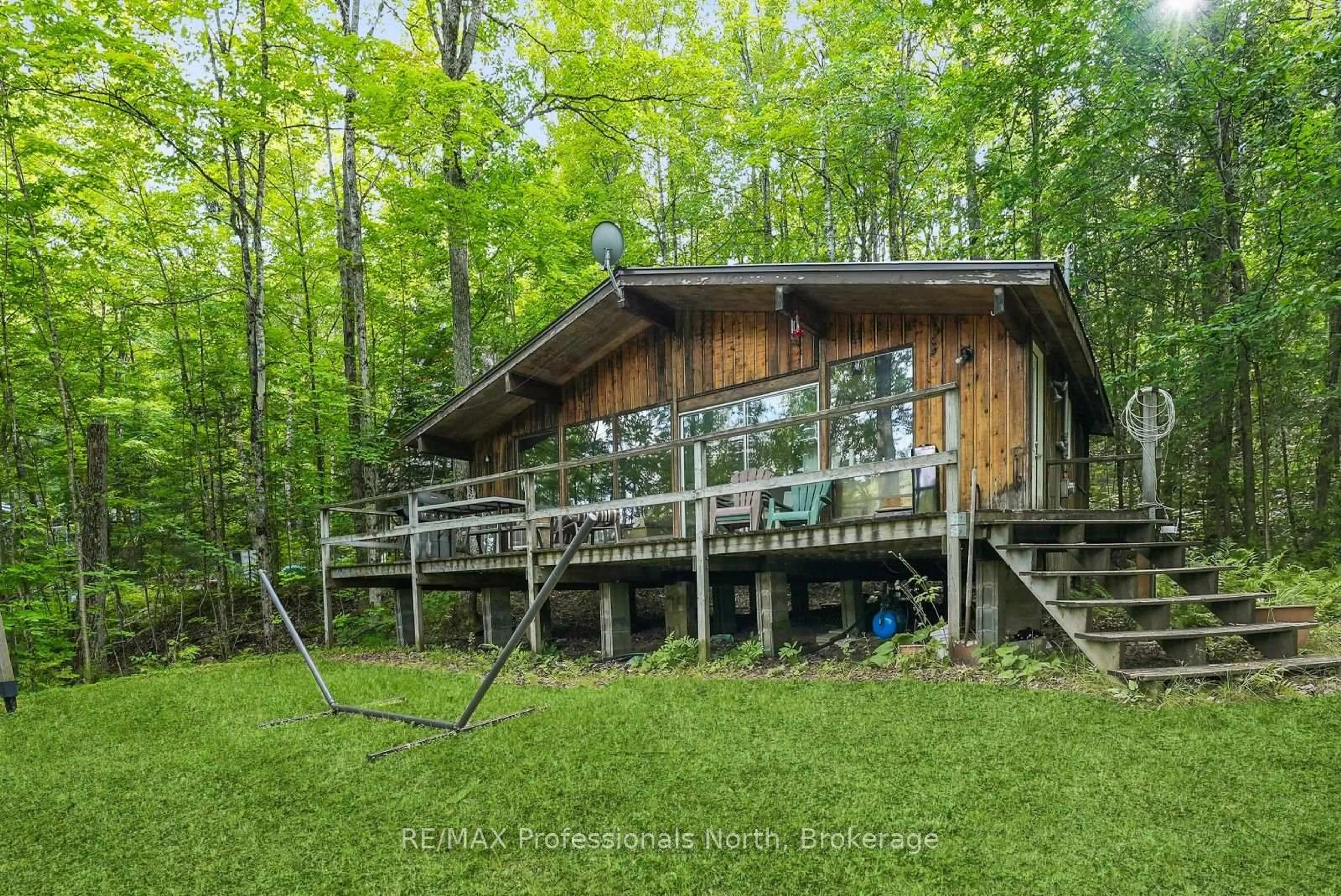 A pic from outside/outdoor area/front of a property/back of a property/a pic from drone, forest/trees view for 1009 Spencers Tr, Highlands East Ontario K0M 1X0