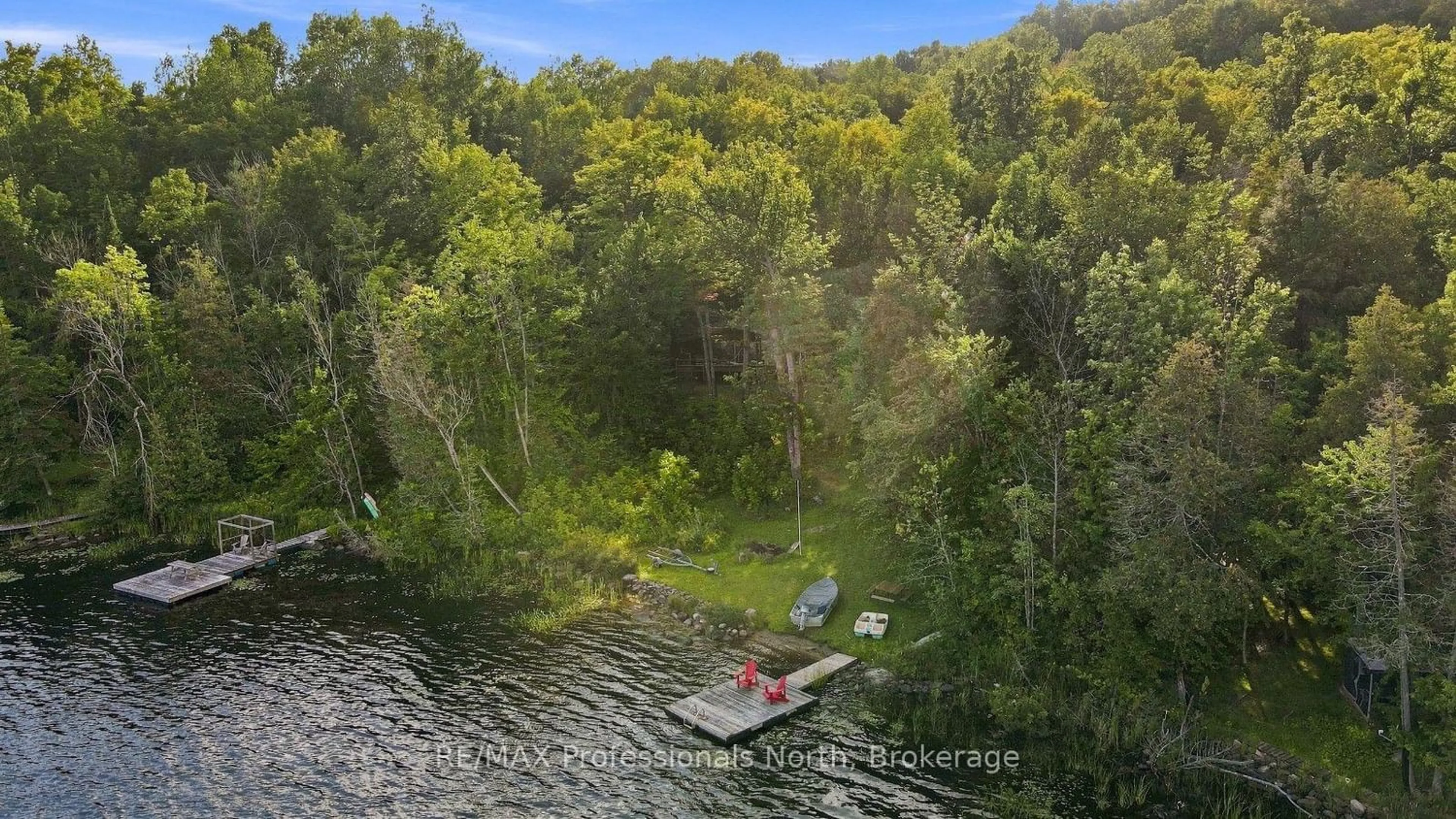 A pic from outside/outdoor area/front of a property/back of a property/a pic from drone, water/lake/river/ocean view for 1009 Spencers Tr, Highlands East Ontario K0M 1X0