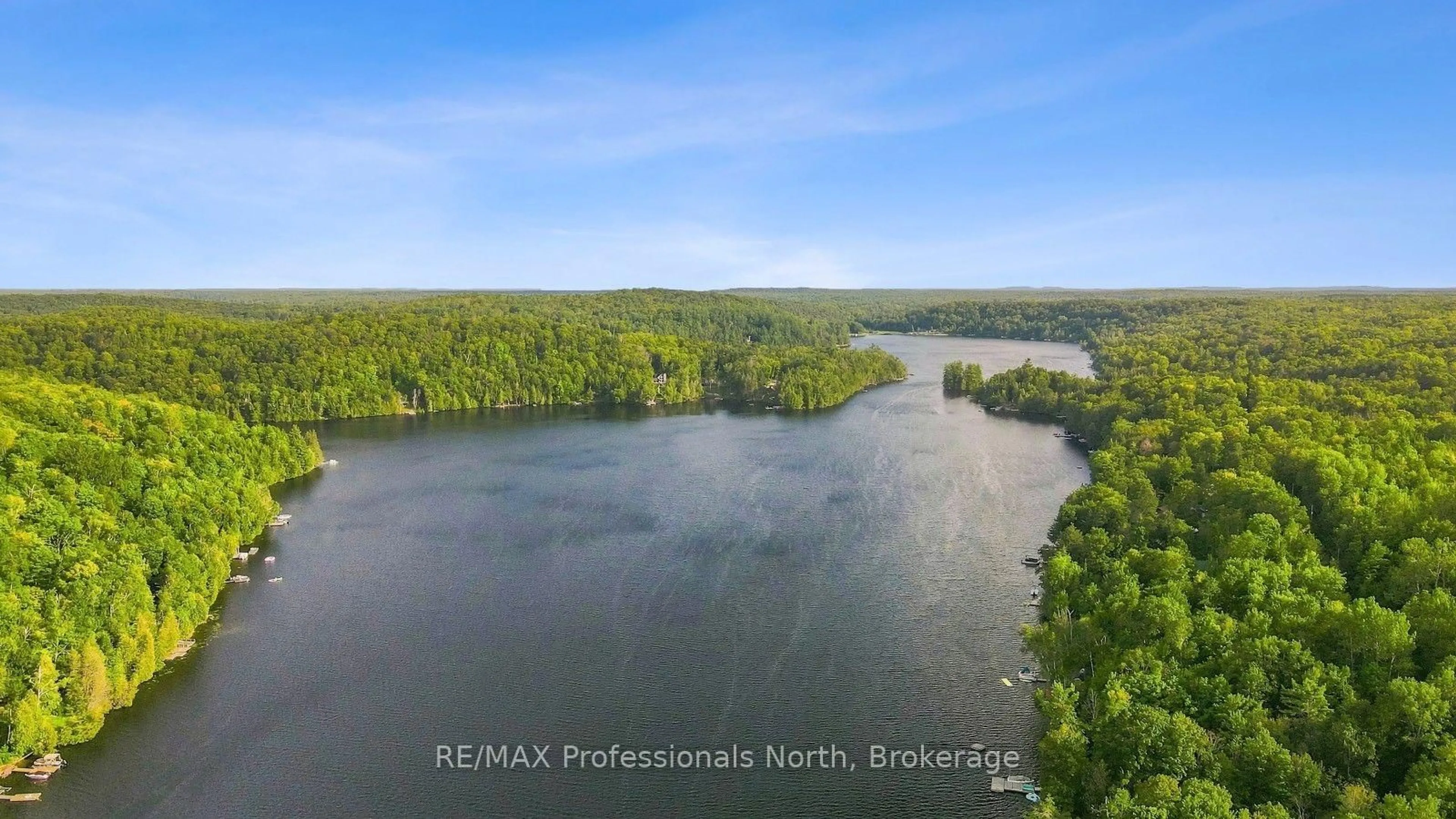 A pic from outside/outdoor area/front of a property/back of a property/a pic from drone, water/lake/river/ocean view for 1009 Spencers Tr, Highlands East Ontario K0M 1X0
