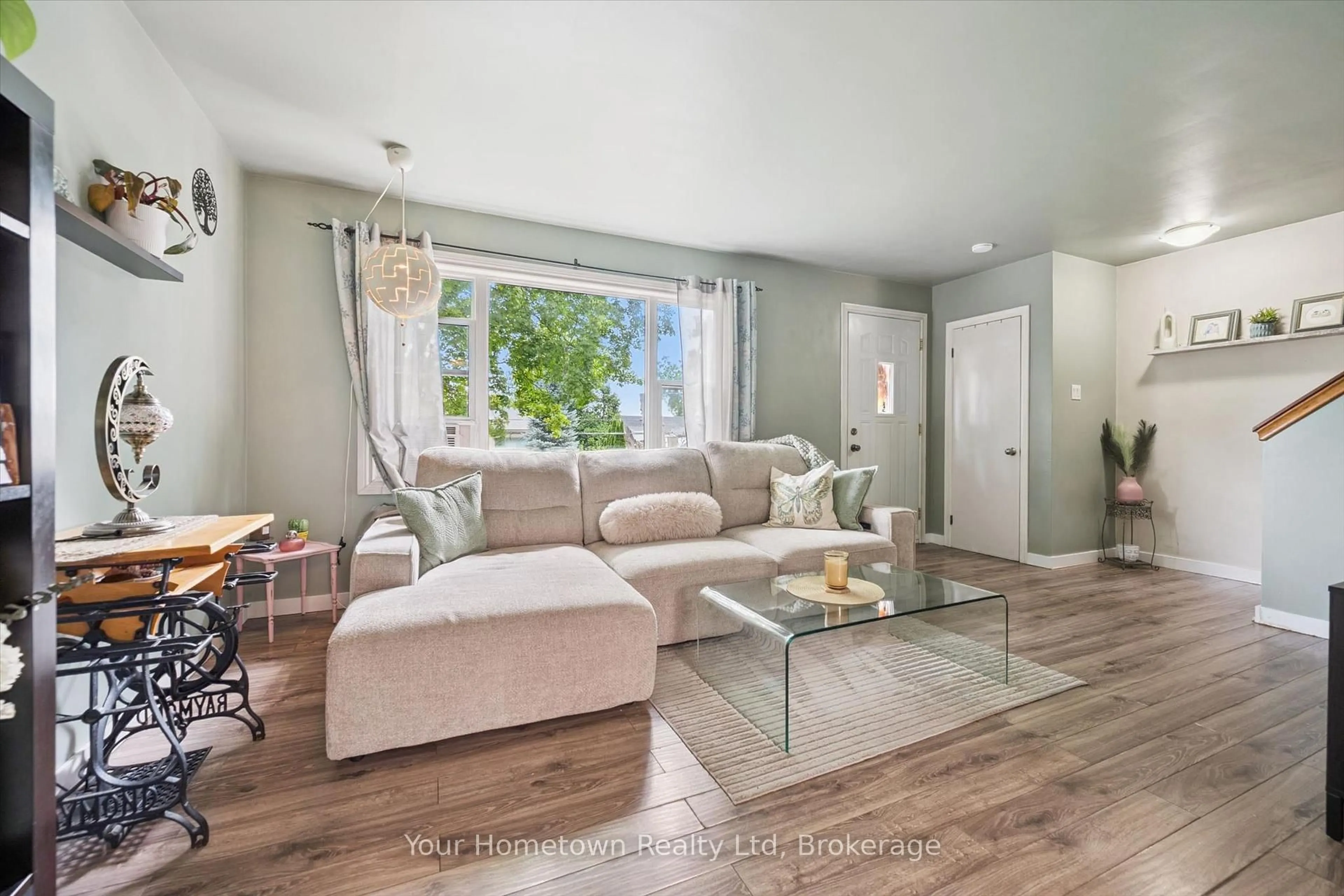 Living room with furniture, wood/laminate floor for 497 St Patrick St, Centre Wellington Ontario N1M 1N1